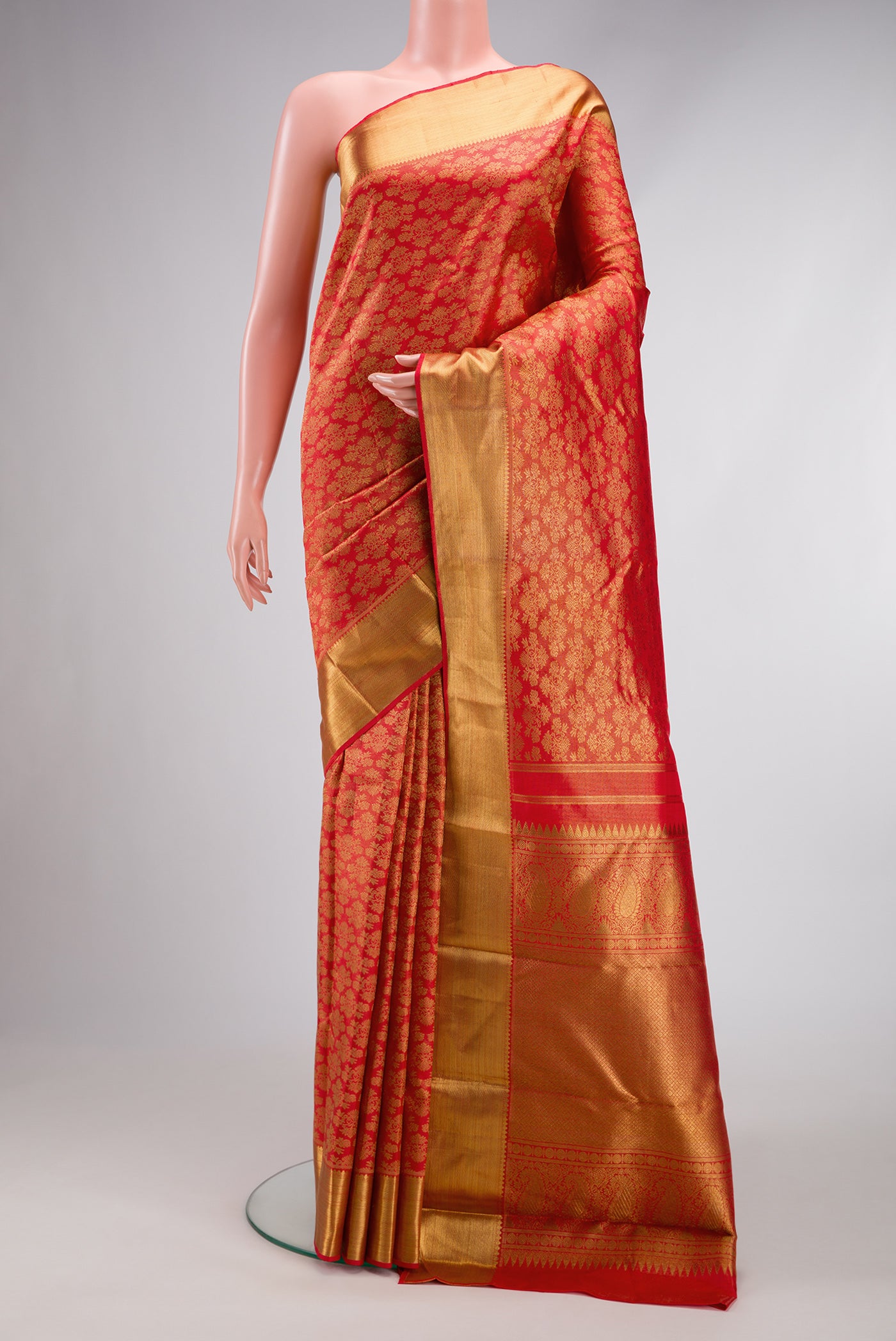 Pure Silk Pure Zari Red Dual Tone Kanjivaram Saree with Zari Brocade on the body and Zari Border.  displayed on a mannequin