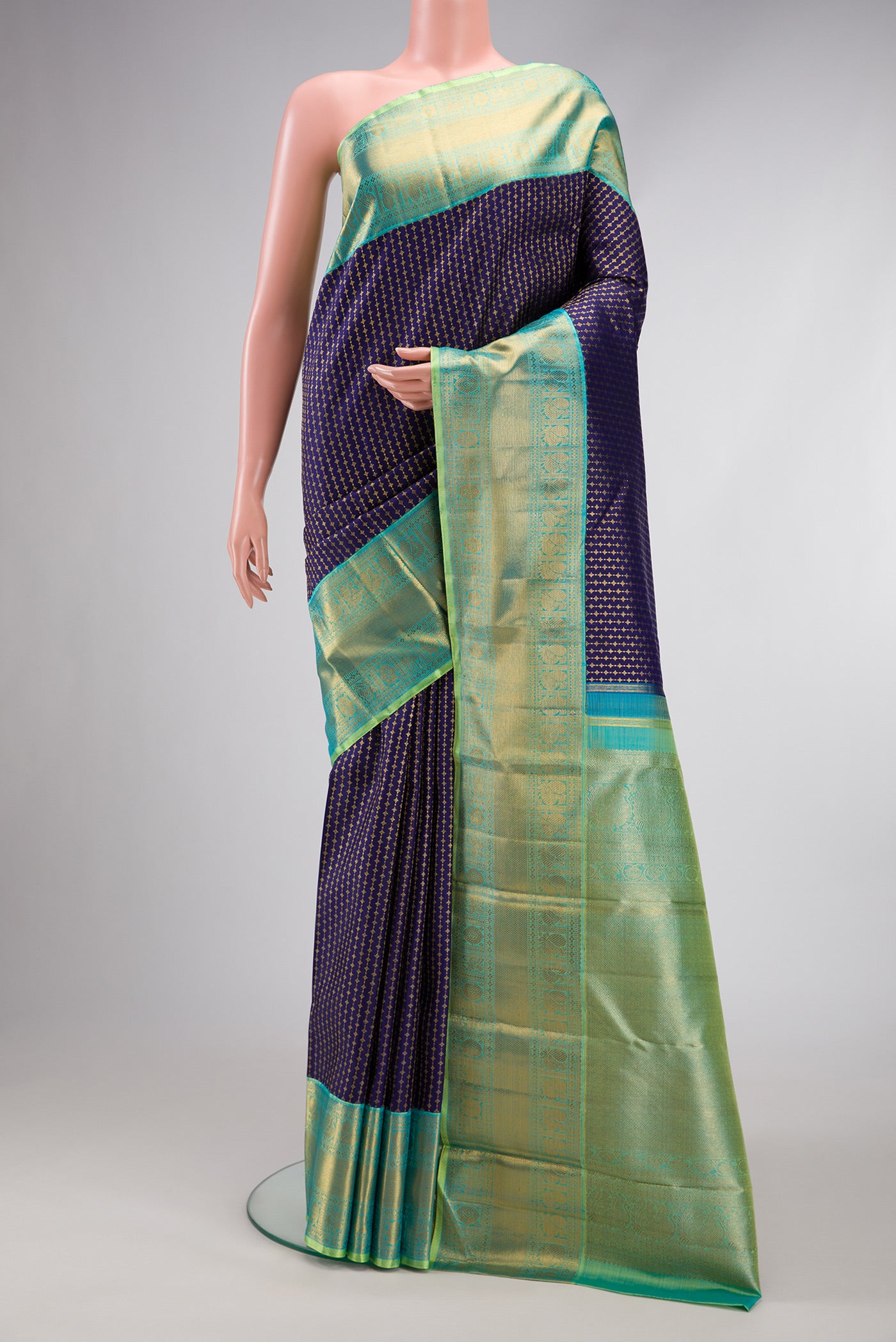 Pure Silk Pure Zari Navy Blue Kanjivaram Saree with Zari Brocade on the body and Zari Border.  displayed on a mannequin