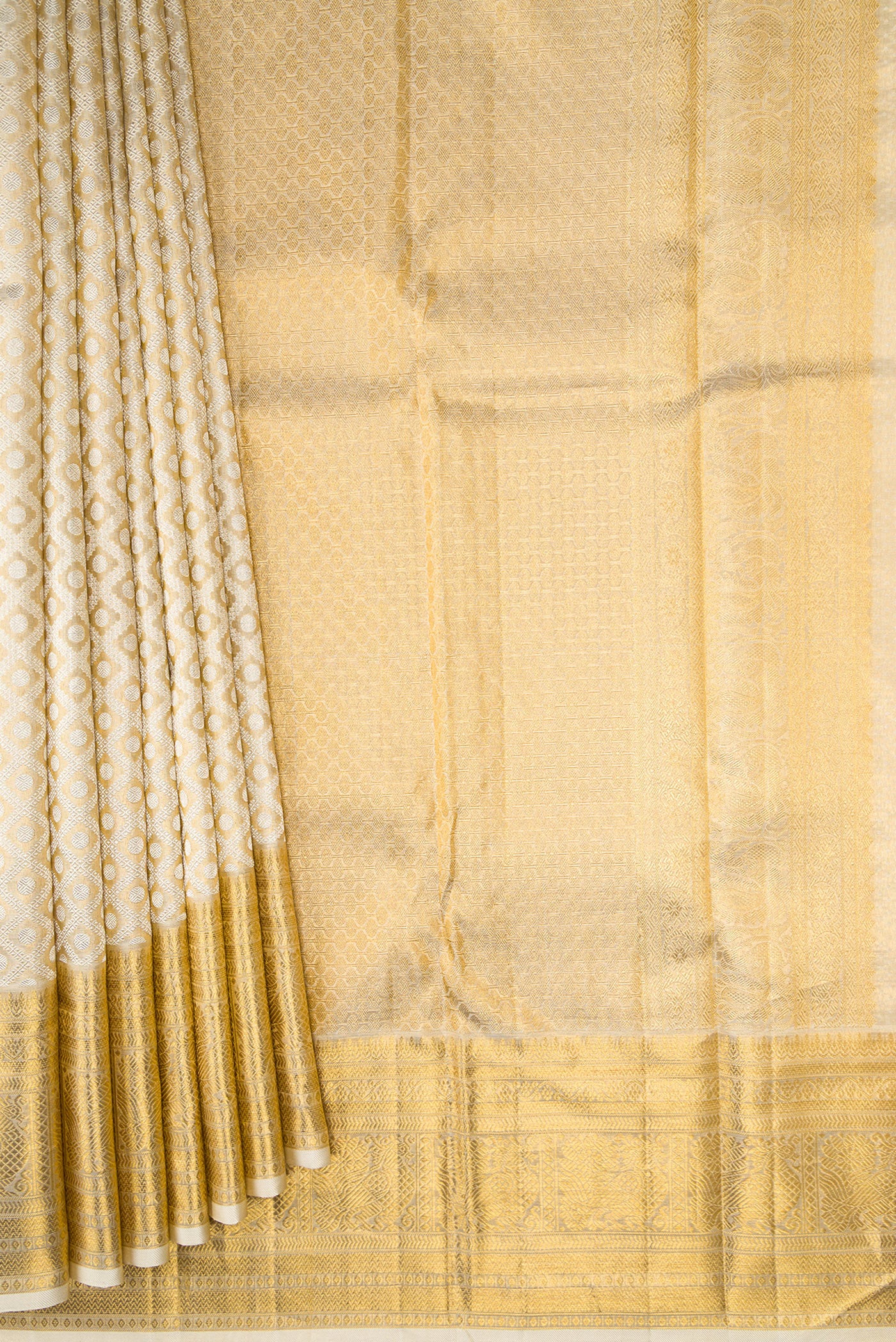Pleats and pallu of Gold Dual Tone Kanjivaram Tissue Silk Saree with Zari Brocade on the body and Zari Border. 