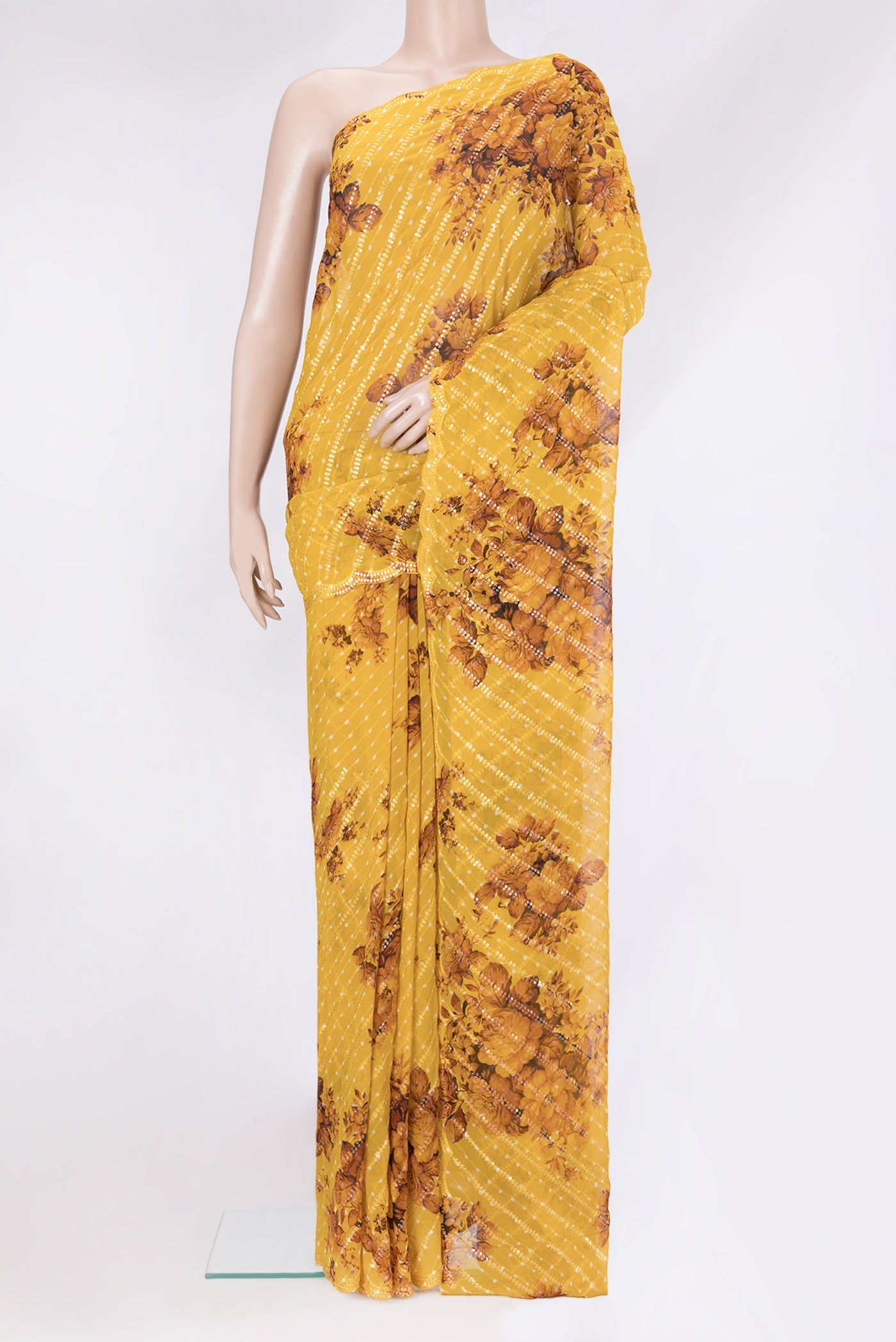 Mustard Georgette Saree with Embroidery on the body and Sequin Border.  displayed on a mannequin