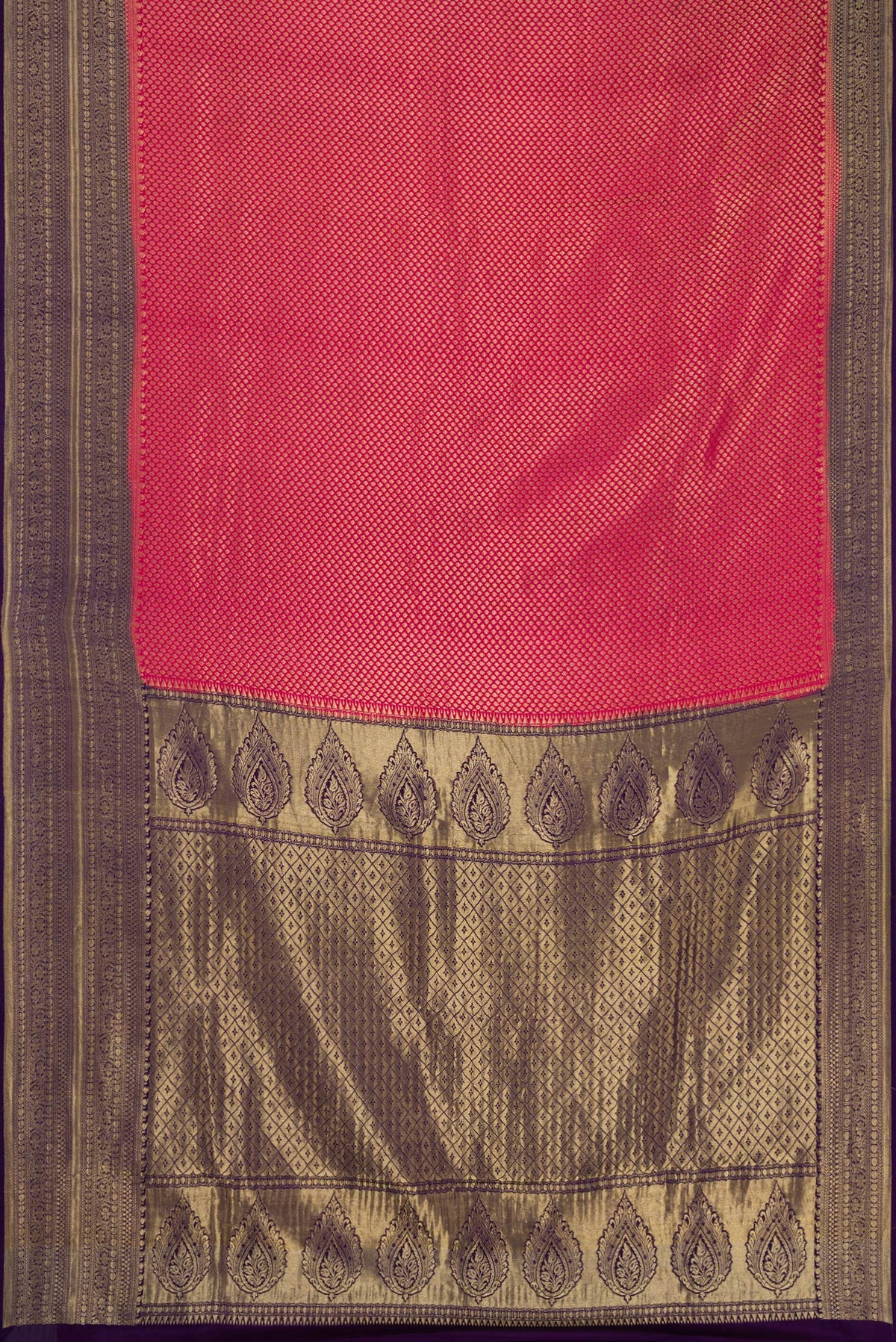 Flat view of Maroon Dual Tone Tussar Silk Saree with Printed design on the body and Zari Border. 