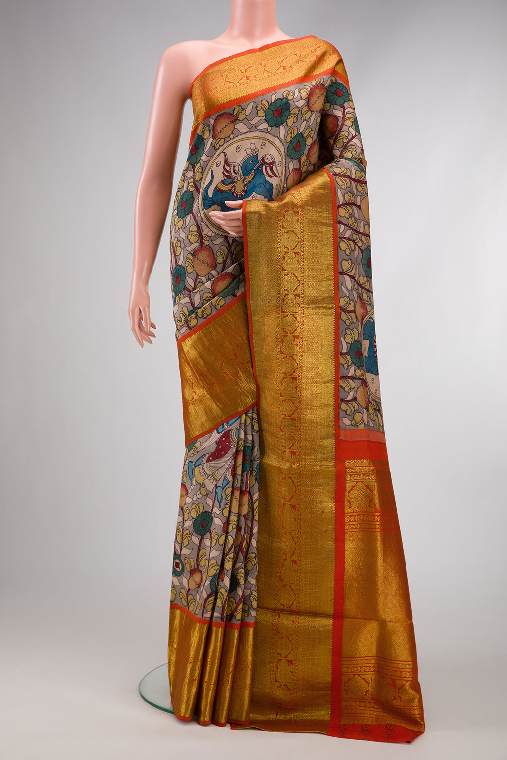 Beige Dual Tone Kanchipuram Silk Saree with kalamkari Print on the body and Zari Border.  displayed on a mannequin