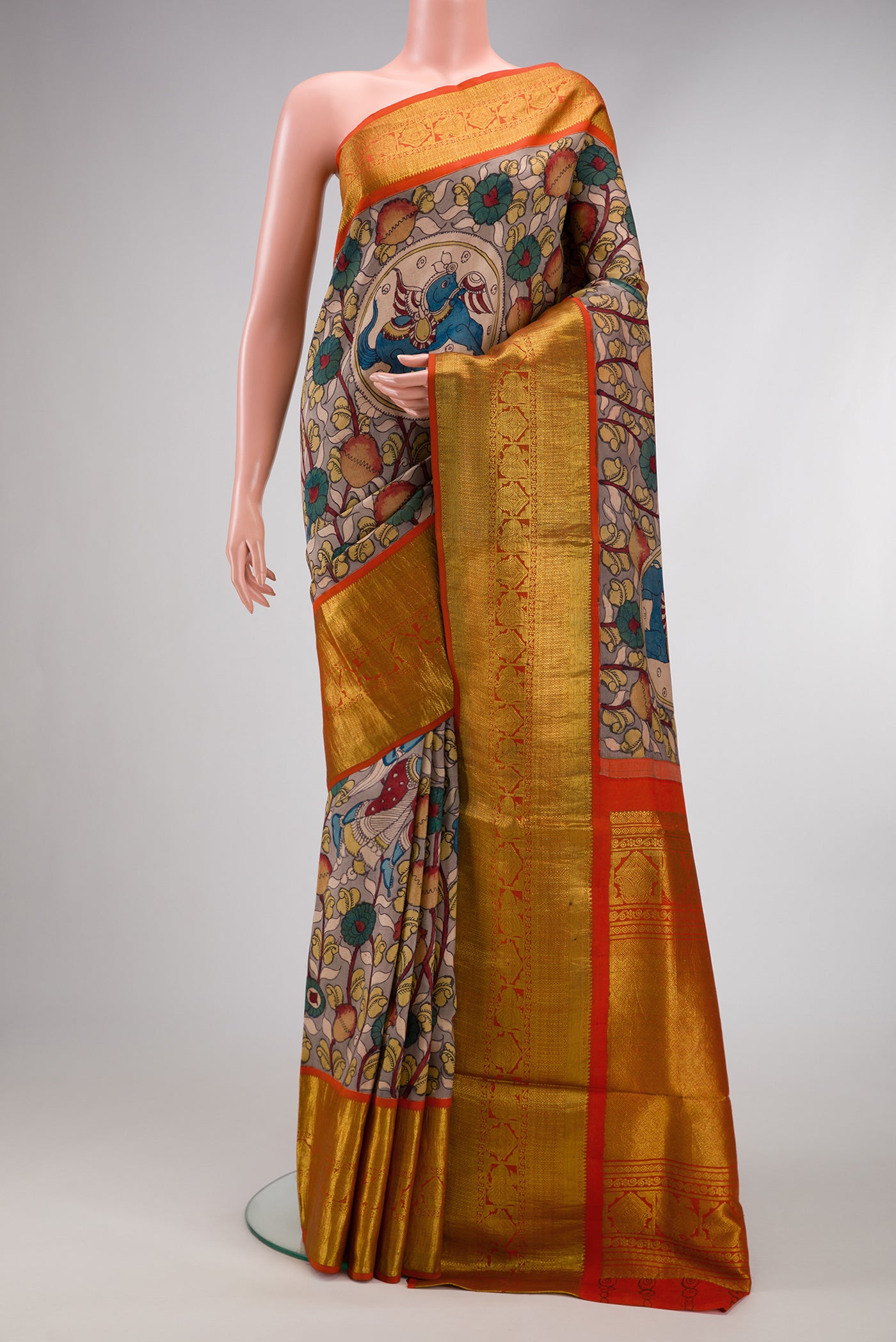 Beige Dual Tone Kanchipuram Silk Saree with kalamkari Print on the body and Zari Border.  displayed on a mannequin