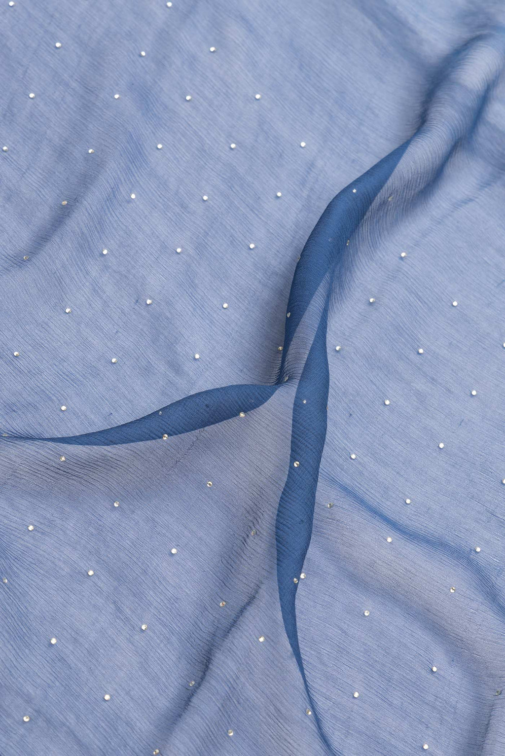 Close up of Maya Blue Dual Tone Mysore Georgette Saree with Embroidery on the body and Zari Border.  displaying folds