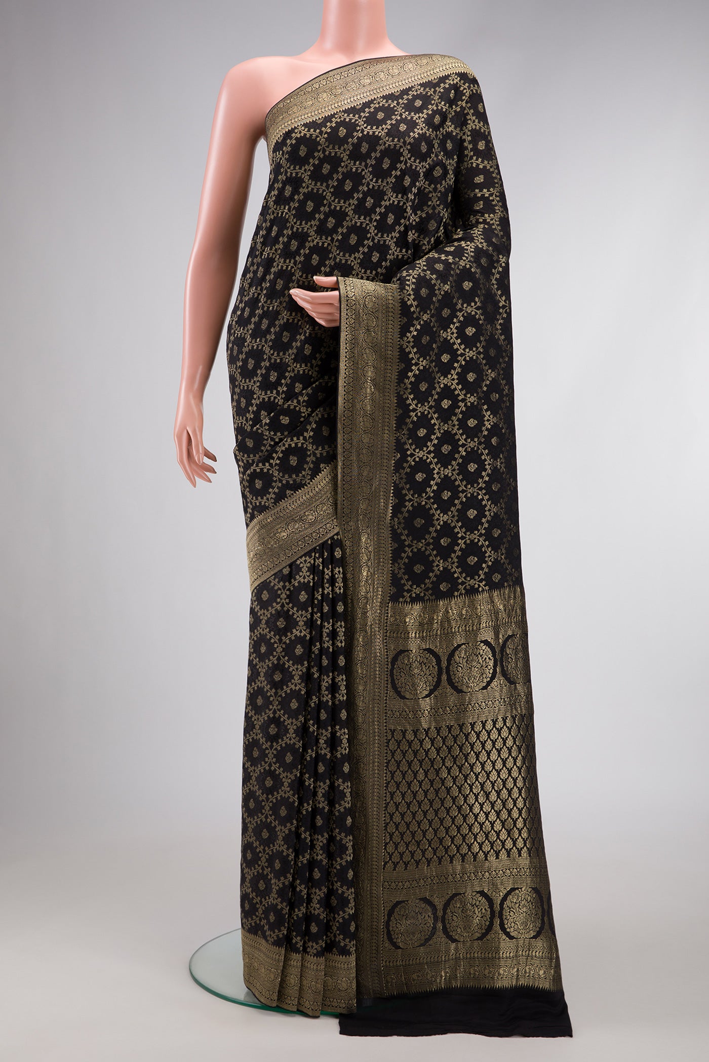 Black Dual Tone Mysore Georgette Saree with Zari Brocade on the body and Zari Border.  displayed on a mannequin