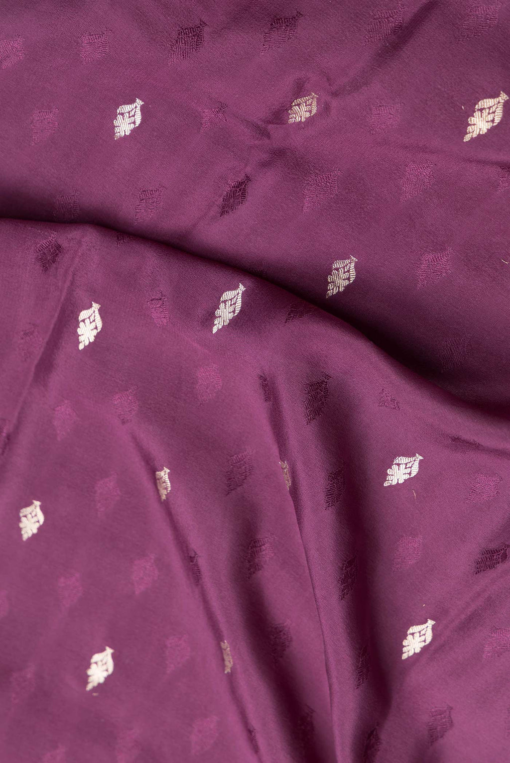 Close up of Purple Dual Tone Mysore Georgette Saree with Zari And Thread Butta on the body and Zari Border.  displaying folds