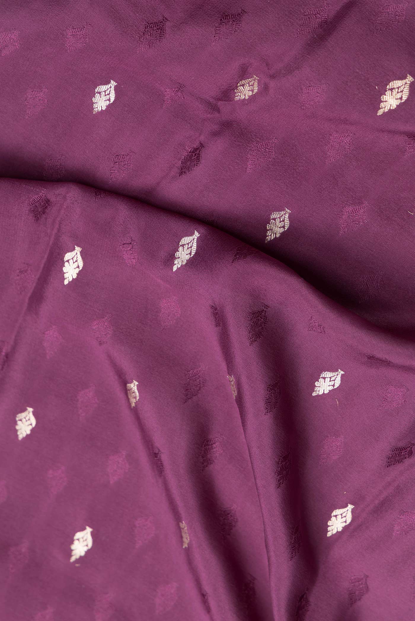 Close up of Purple Dual Tone Mysore Georgette Saree with Zari And Thread Butta on the body and Zari Border.  displaying folds