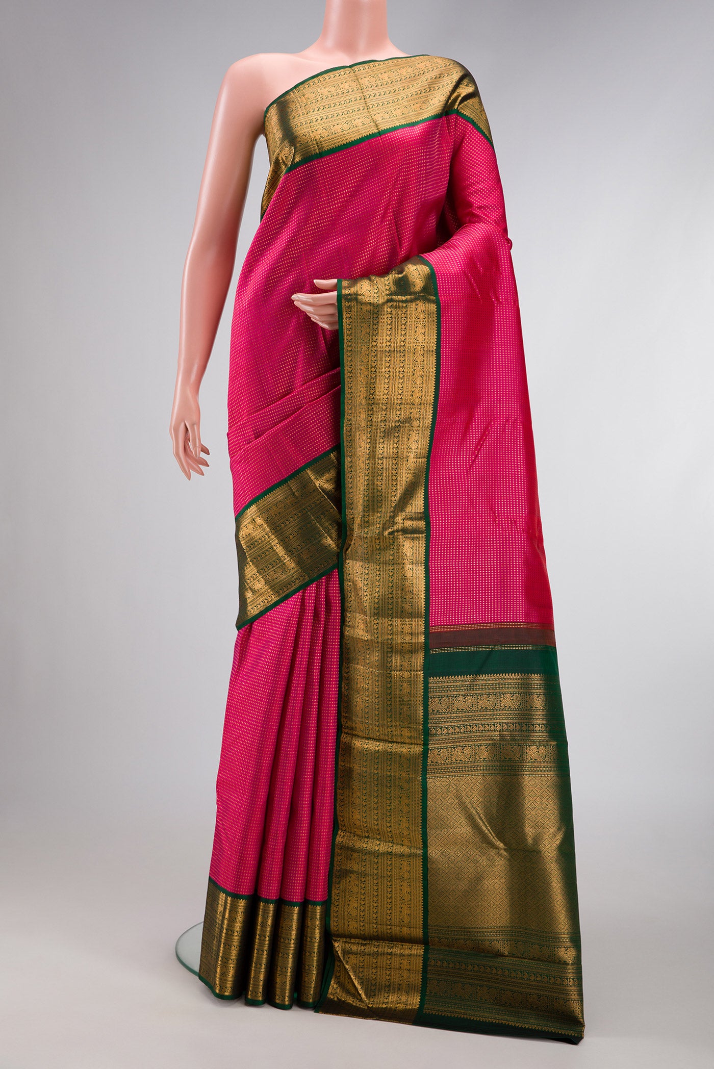 Dark Pink Dual Tone Kanjivaram Silk Saree with Stripes on the body and Zari Border.  displayed on a mannequin