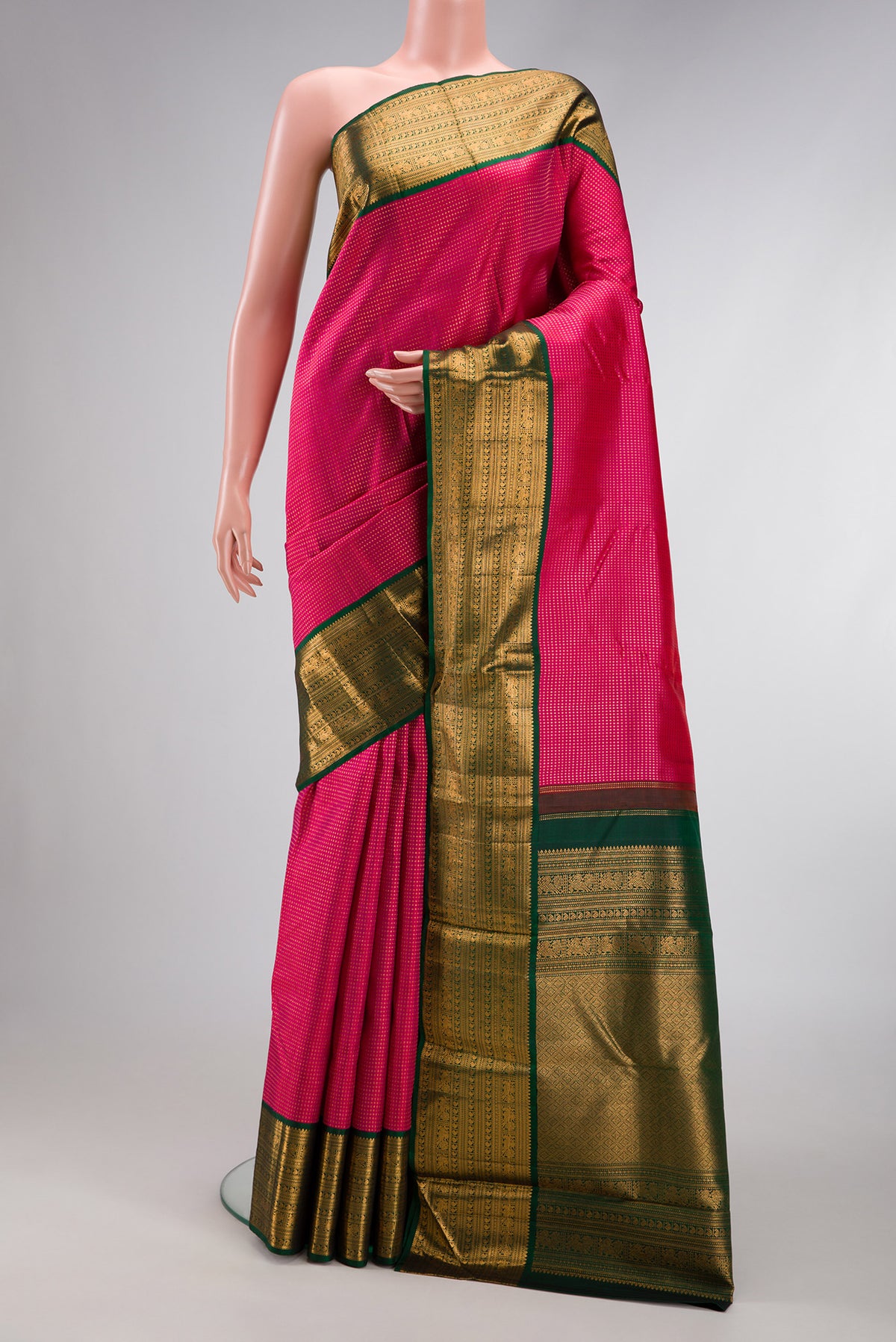 Dark Pink Dual Tone Kanjivaram Silk Saree with Stripes on the body and Zari Border.  displayed on a mannequin