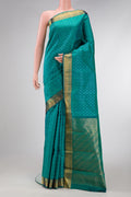 Peacock Blue Dual Tone Kanjivaram Silk Saree with Jacquard design on the body and Zari Border.  displayed on a mannequin