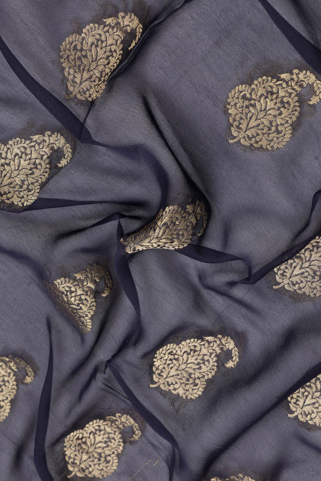 Close up of Navy Blue Dual Tone Mysore Georgette Saree with Zari Butta on the body and Zari Border.  displaying folds
