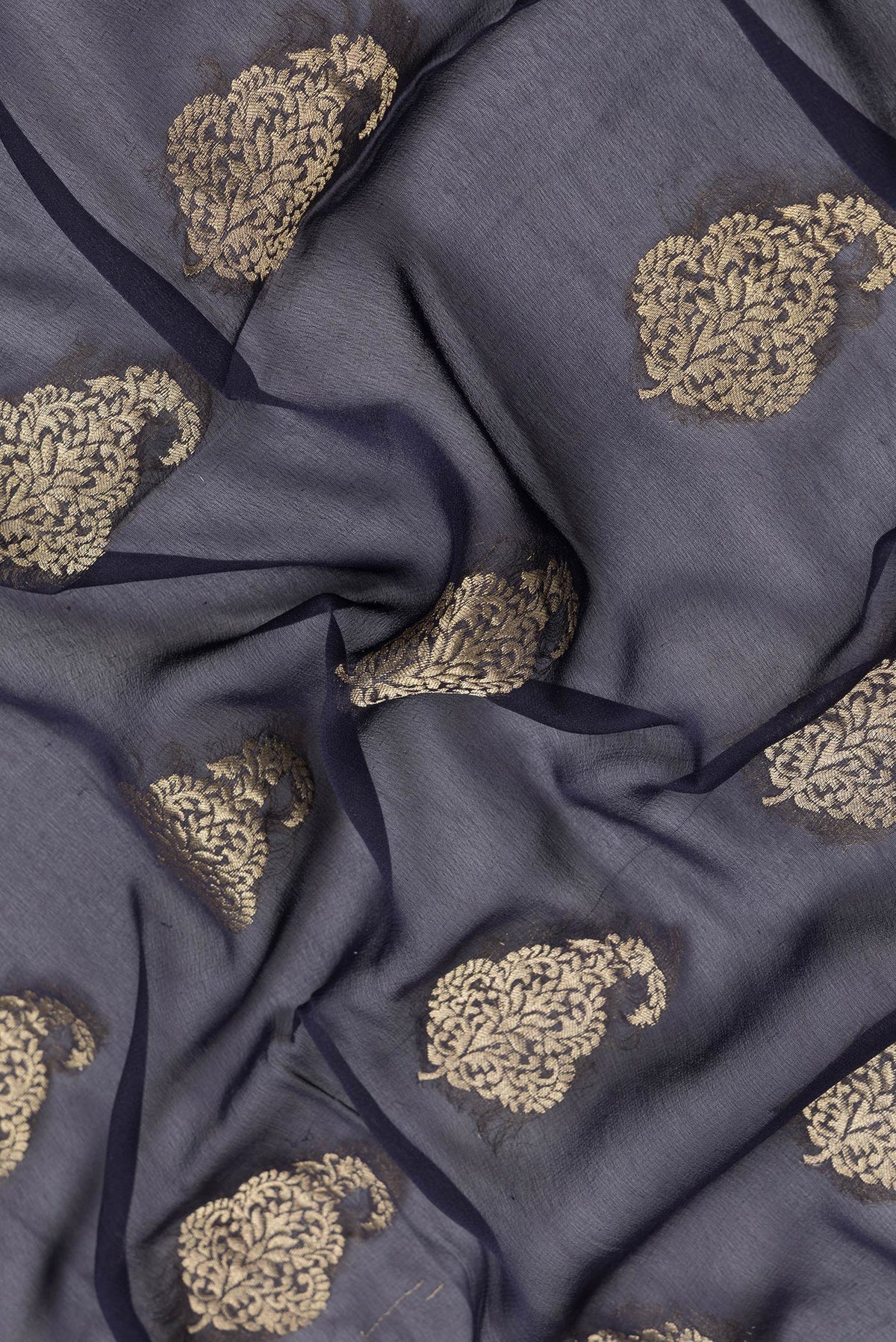 Close up of Navy Blue Dual Tone Mysore Georgette Saree with Zari Butta on the body and Zari Border.  displaying folds
