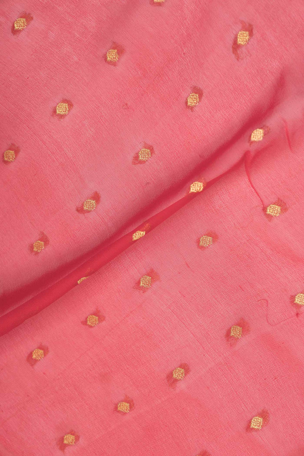 Close up of Red Mysore Georgette Saree with Zari Butta on the body and Zari Border displaying folds