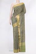 Green Dual Tone Tussar Silk Saree with Printed design on the body and Zari Border.  displayed on a mannequin