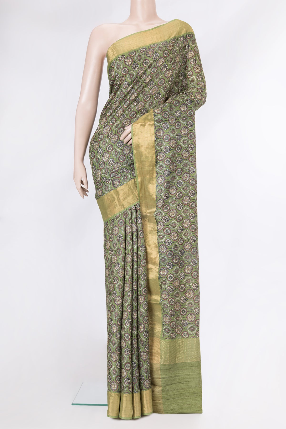 Green Dual Tone Tussar Silk Saree with Printed design on the body and Zari Border.  displayed on a mannequin