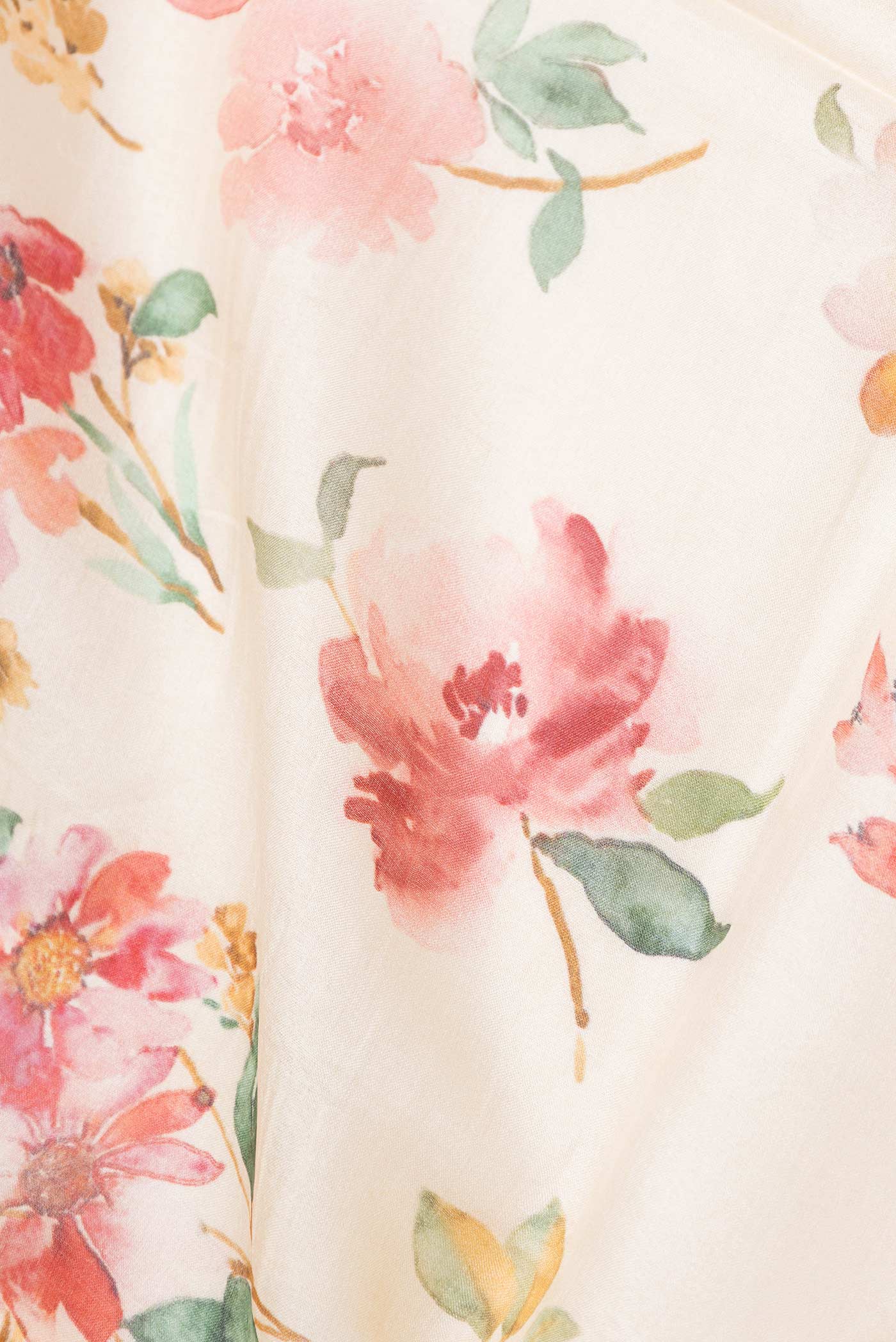 Close up of Peach Dual Tone Tussar Silk Saree with Printed design on the body and Zari Border displaying folds