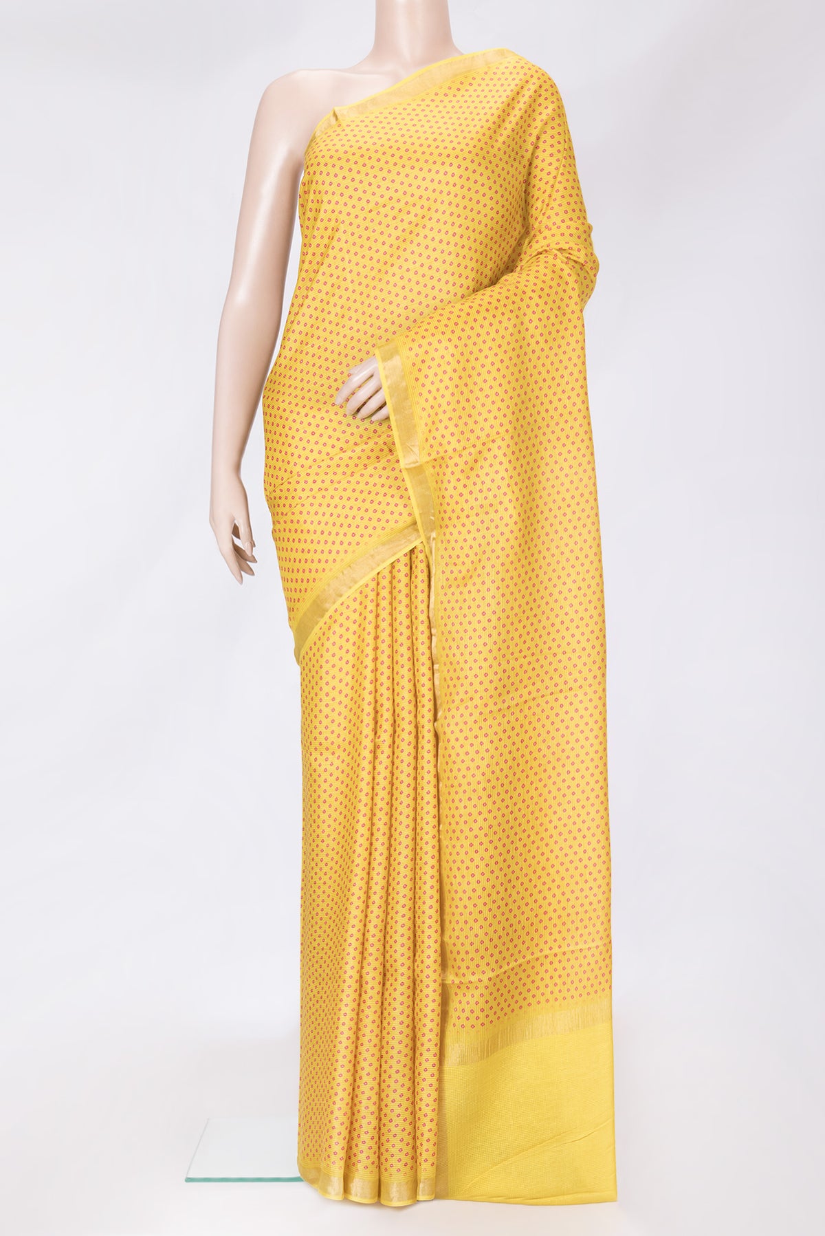Yellow Dual Tone Tussar Silk Saree with Bandhani Print on the body and Zari Border.  displayed on a mannequin