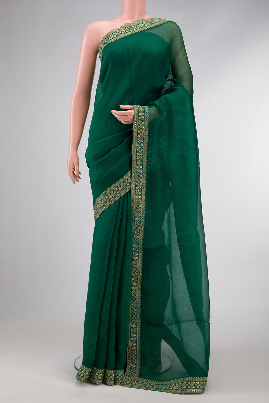 Bottle Green Dual Tone Organza Silk Saree with Plain Body and Embroidery Border.  displayed on a mannequin