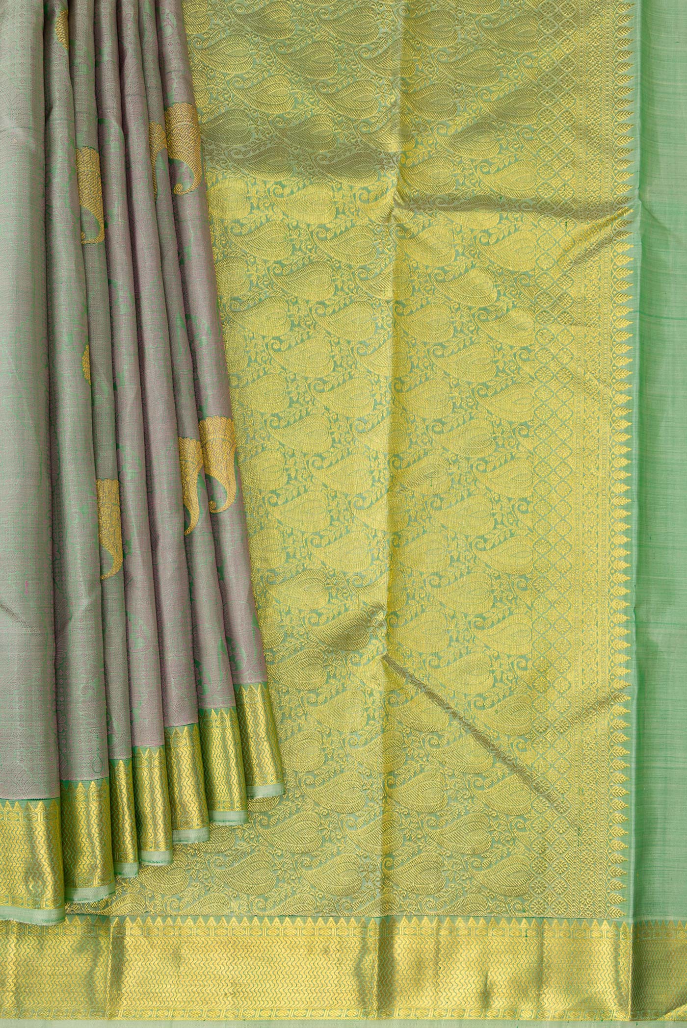 Pleats and pallu of Pista Green Dual Tone Kanjivaram Silk Saree with Jacquard With Zari Butta on the body and Zari Border. 