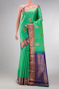 Sea Green Dual Tone Kanchipuram Silk Saree with Jacquard With Zari Butta on the body and Zari Border.  displayed on a mannequin