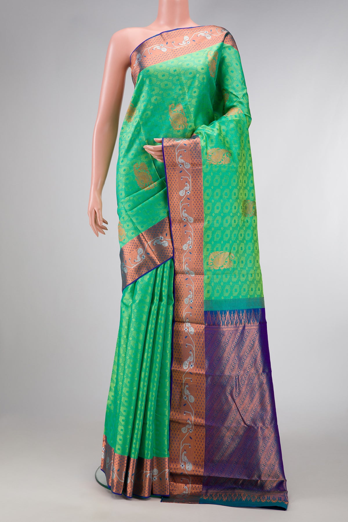 Sea Green Dual Tone Kanchipuram Silk Saree with Jacquard With Zari Butta on the body and Zari Border.  displayed on a mannequin