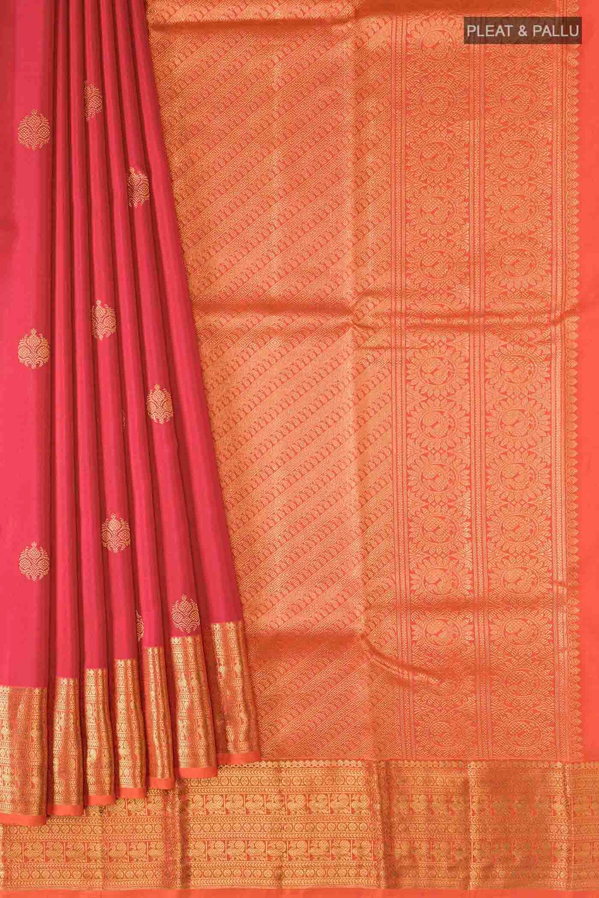 Pleats and pallu of Red Kanchipuram Silk Saree with Zari Butta on the body and Zari Border
