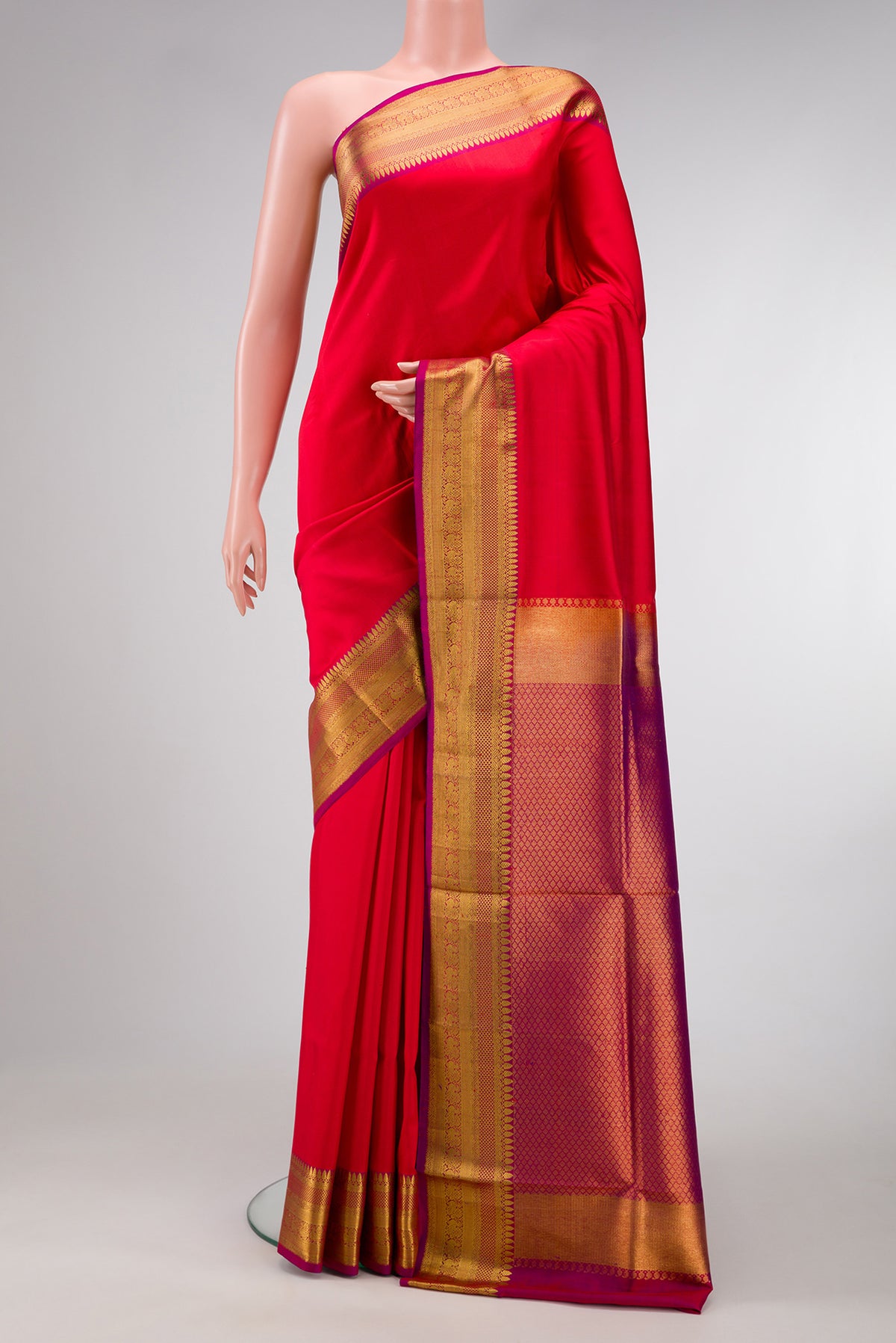 Red Dual Tone Double Ikat Saree with Plain Body and Zari Border.  displayed on a mannequin