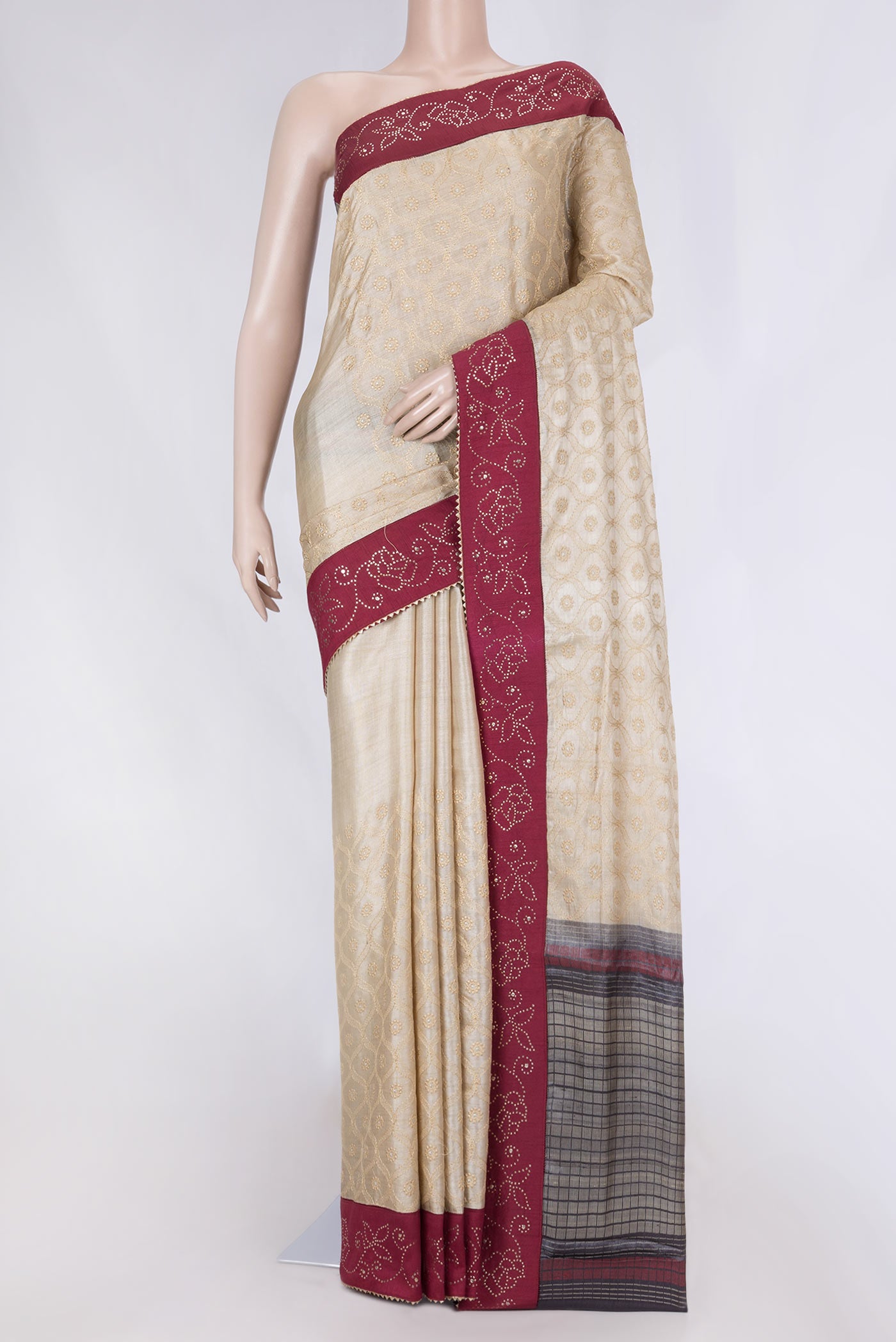 Beige Dual Tone Tussar Saree with Embroidery on the body and Embroidery Border displayed on a mannequin