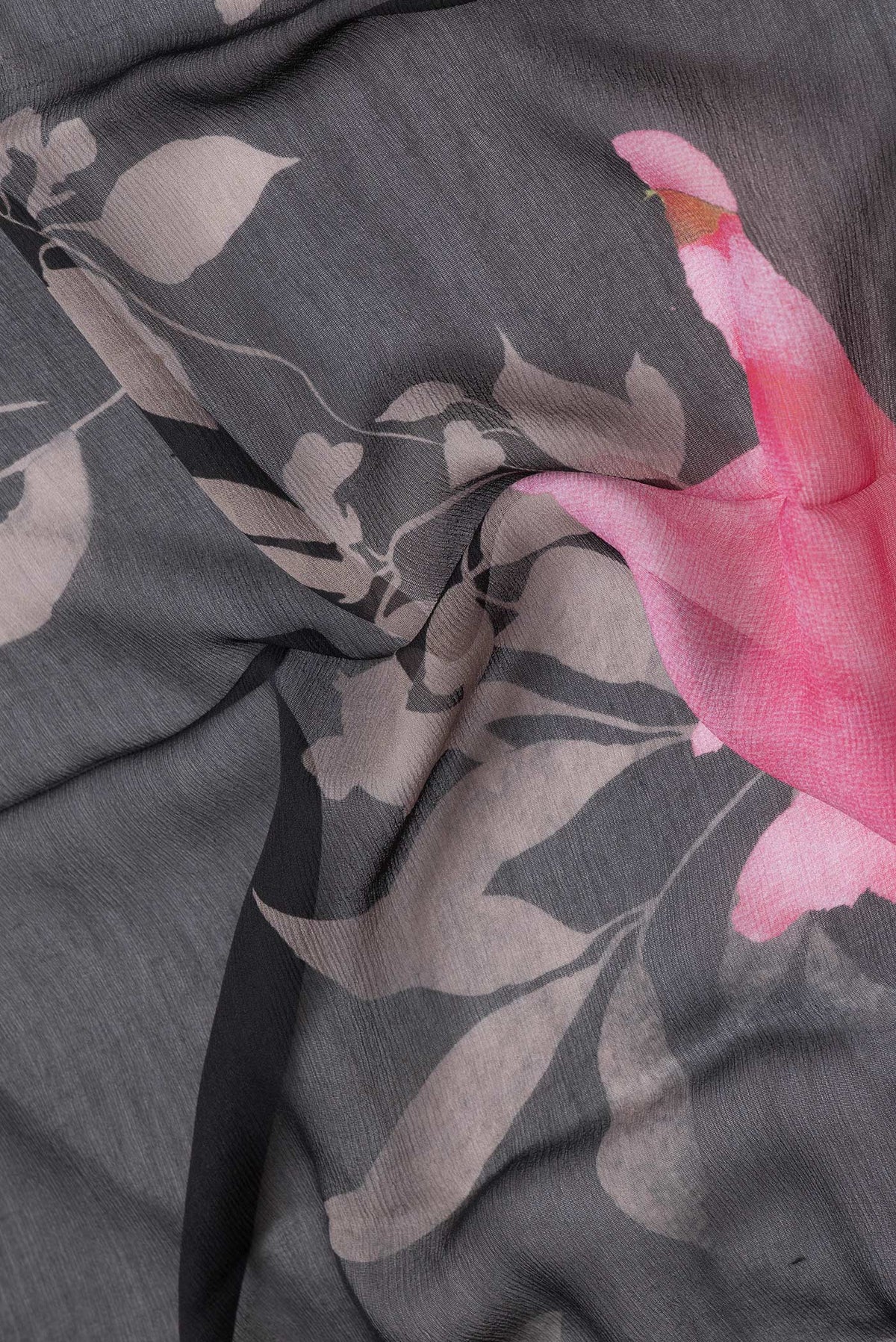 Close up of Black Dual Tone Mysore Chiffon Saree with Printed design on the body and Without Border.  displaying folds