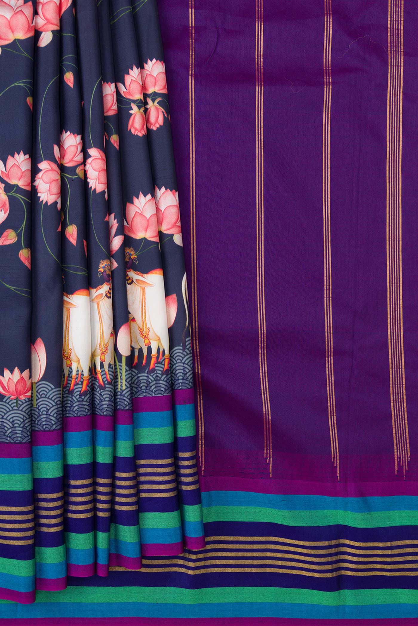 Pleats and pallu of Navy Blue Dual Tone Kanchipuram Silk Saree with Printed design on the body and Zari Border. 