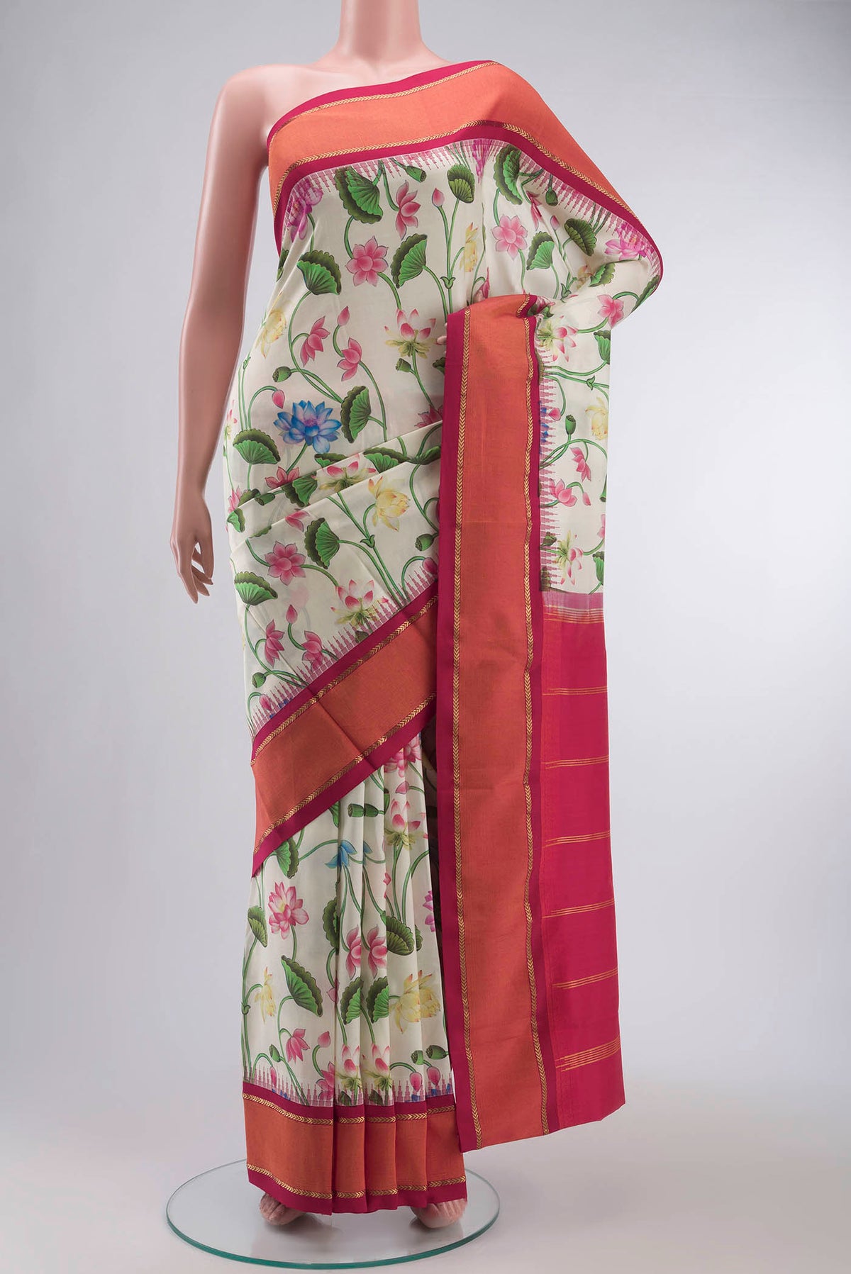 Cream Printed Silk Saree with Printed design on the body and Zari Border displayed on a mannequin