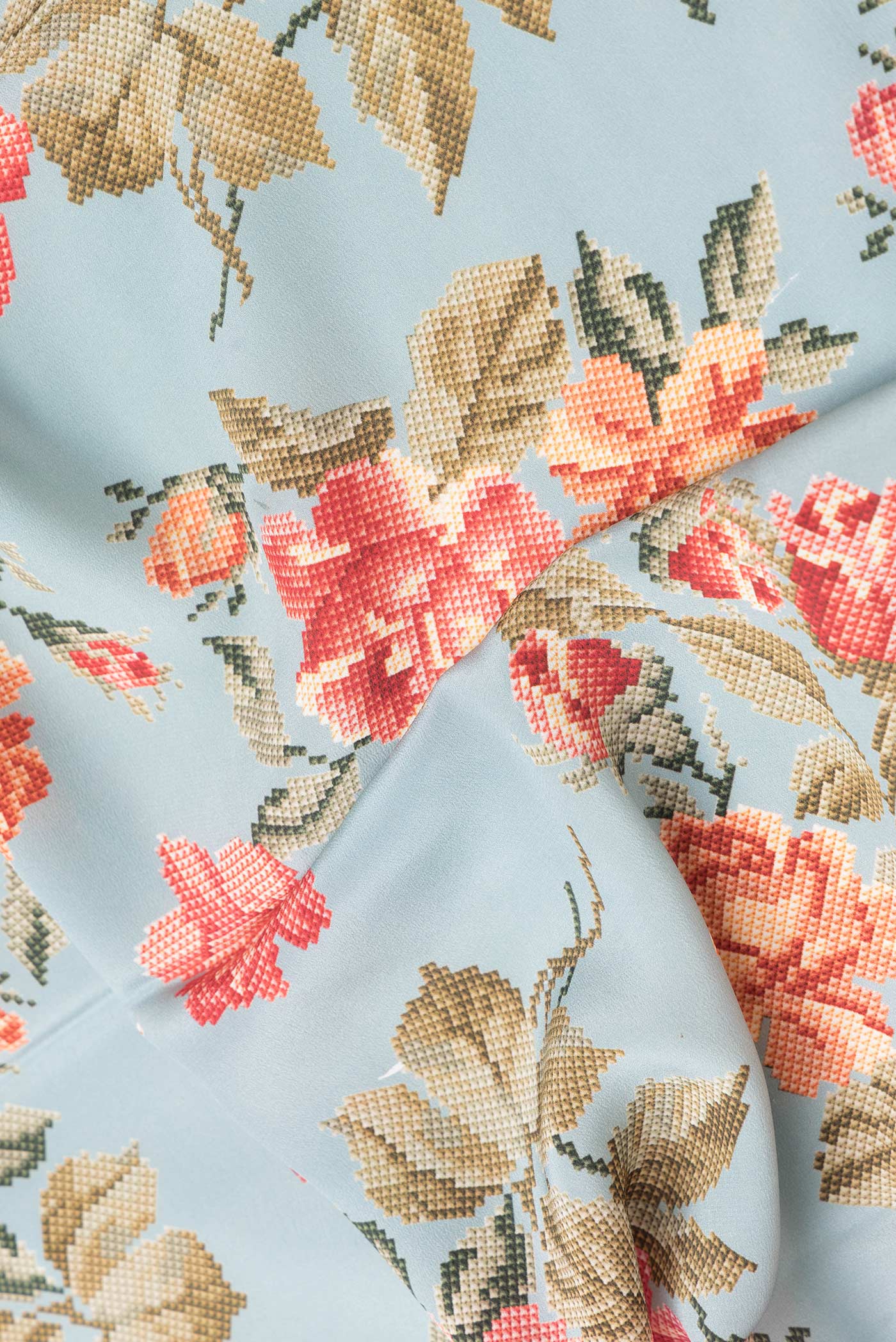 Close up of Grey Dual Tone Mysore Crepe Saree with Printed design on the body and Plain Border.  displaying folds