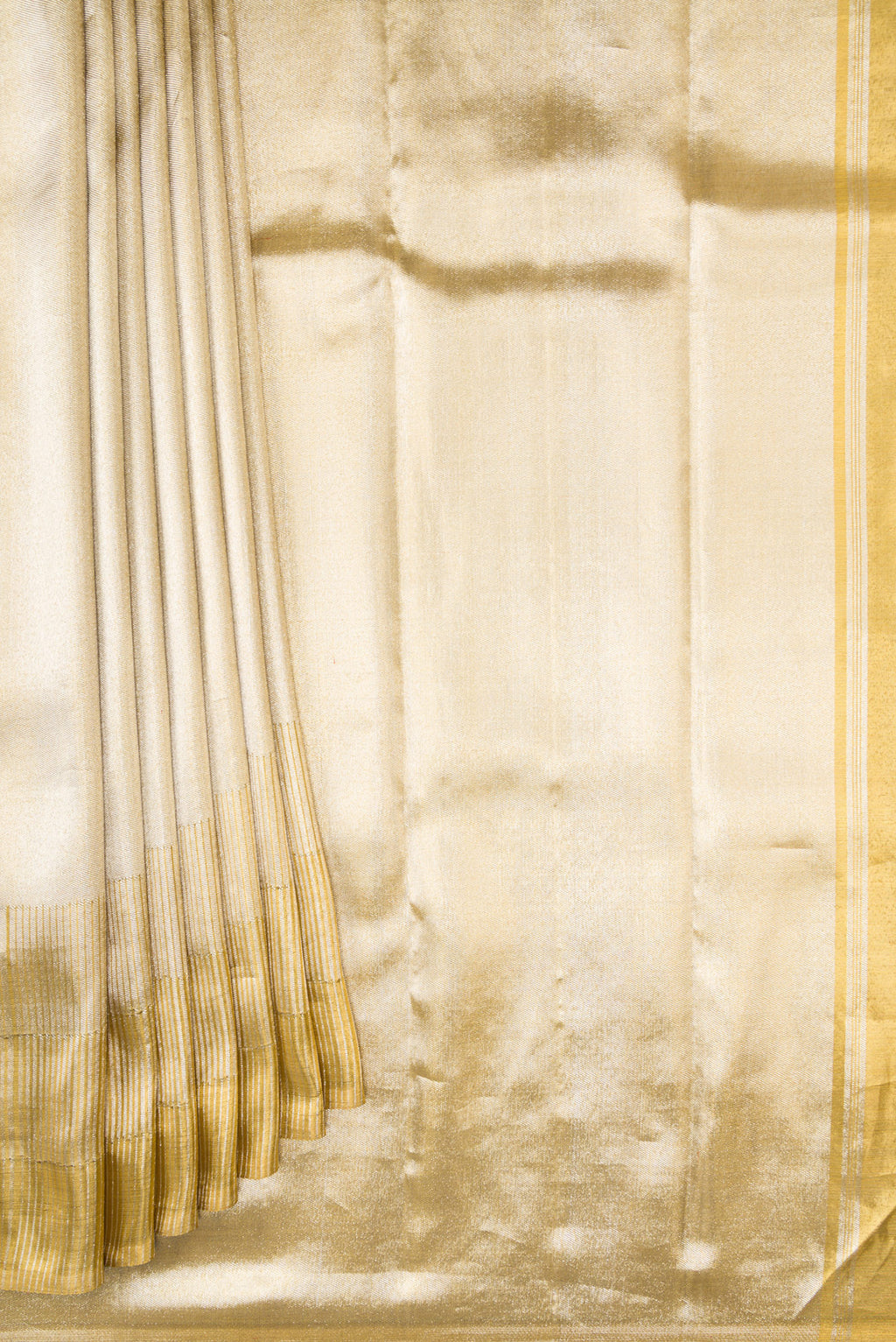 Pleats and pallu of Gold Dual Tone Kanjivaram Tissue Silk Saree with Zari Brocade on the body and Zari Border. 