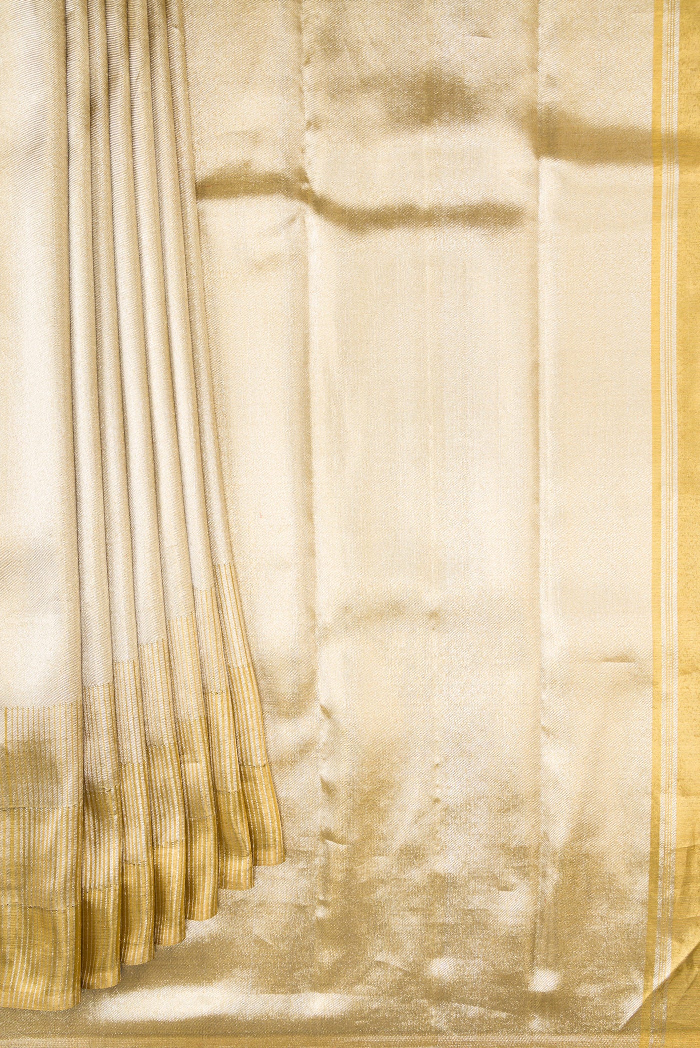 Pleats and pallu of Gold Dual Tone Kanjivaram Tissue Silk Saree with Zari Brocade on the body and Zari Border. 