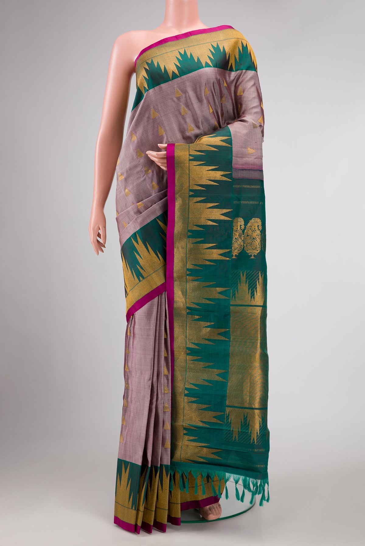 Lavender Gadwal Silk Saree with Zari Butta on the body and Temple Border displayed on a mannequin