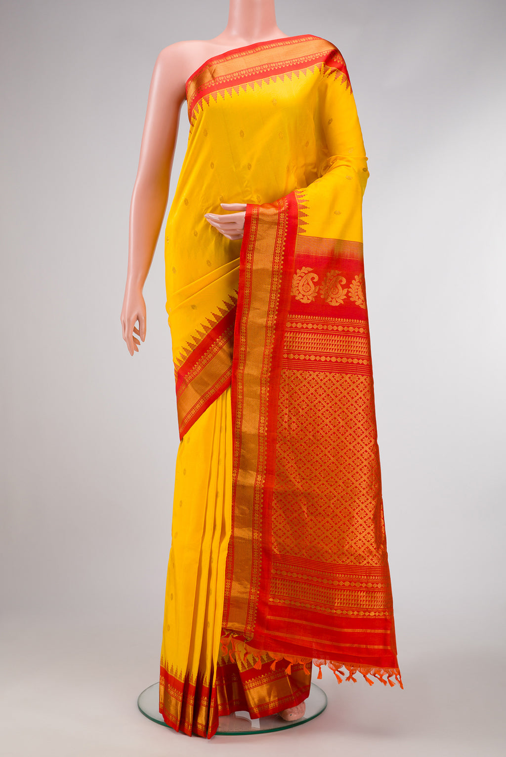 Yellow Dual Tone Gadwal Silk Saree with Zari Butta on the body and Zari Border.  displayed on a mannequin