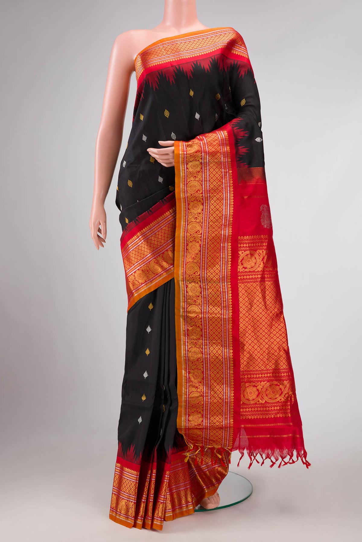 Black Dual Tone Gadwal Silk Saree with Zari Butta on the body and Zari Border displayed on a mannequin