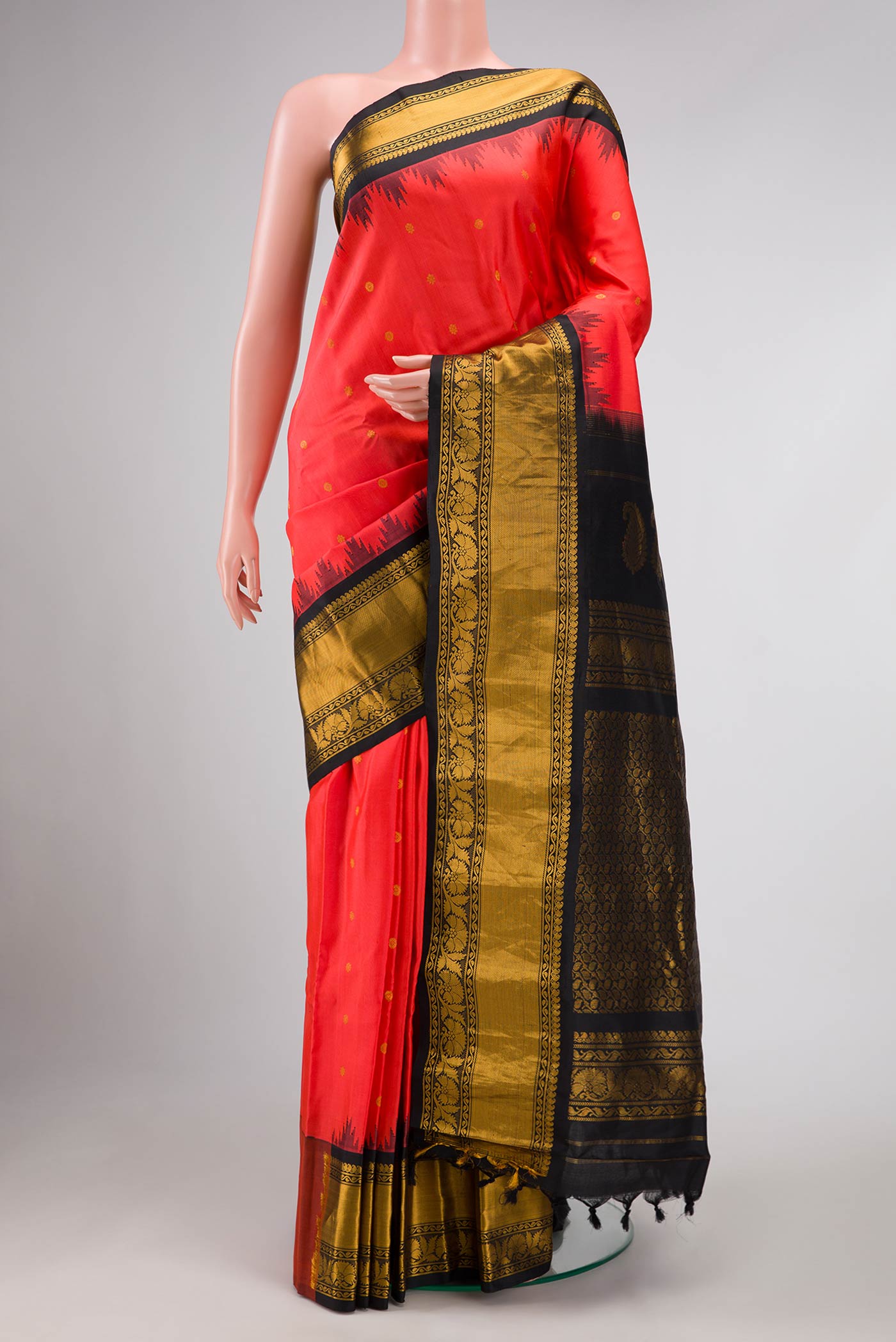 Brick Orange Dual Tone Gadwal Silk Saree with Zari Butta on the body and Zari Border displayed on a mannequin