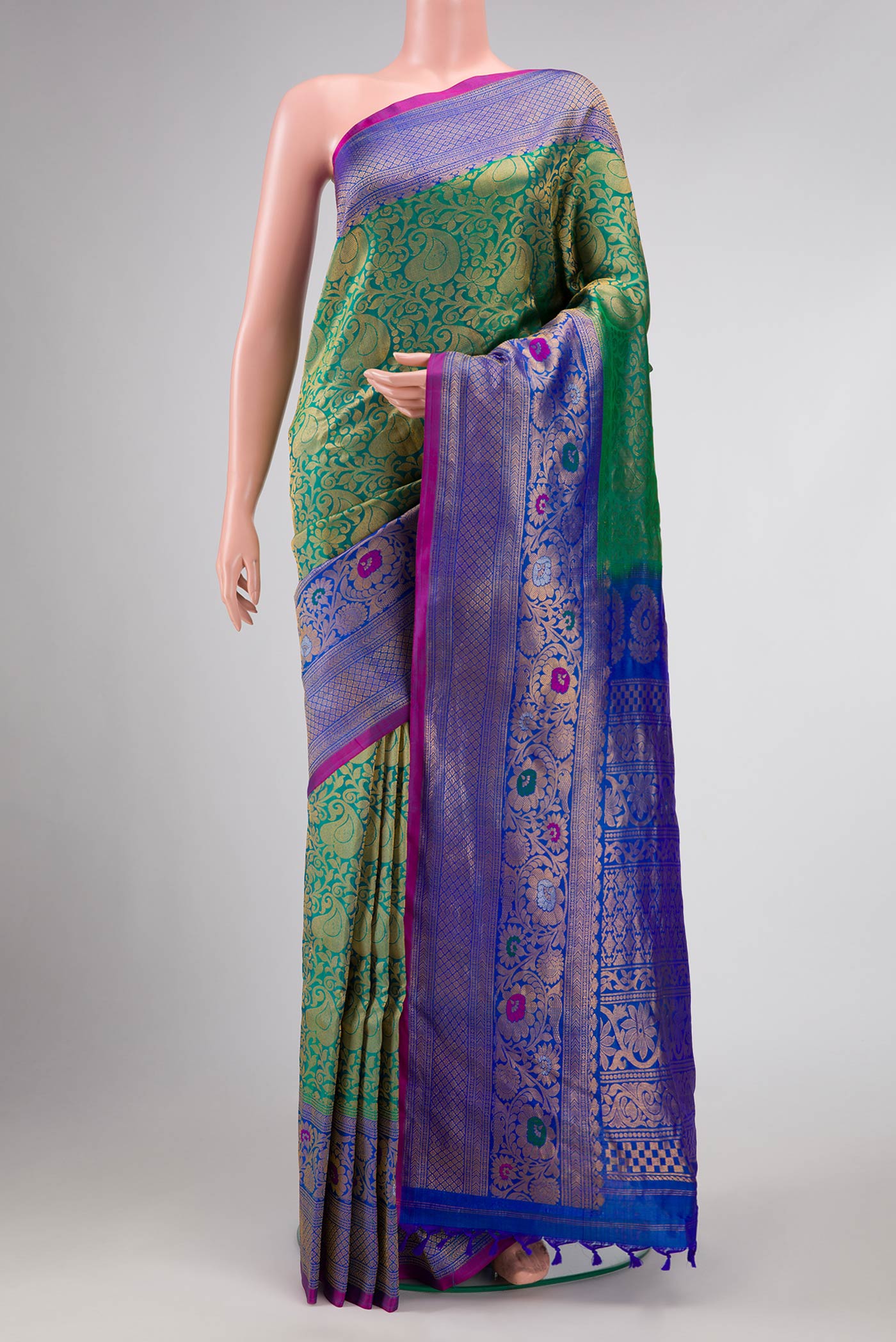 Green Dual Tone Gadwal Silk Saree with Zari Brocade on the body and Zari Border displayed on a mannequin