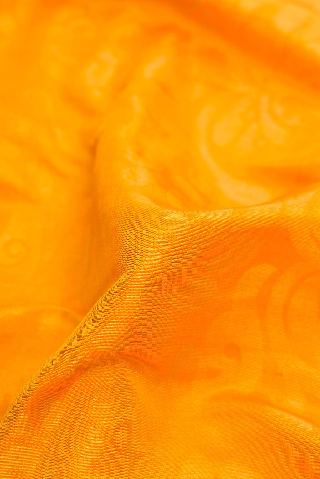 Close up of Mustard Dual Tone Gadwal Silk Saree with Zari Butta on the body and Zari Border displaying folds