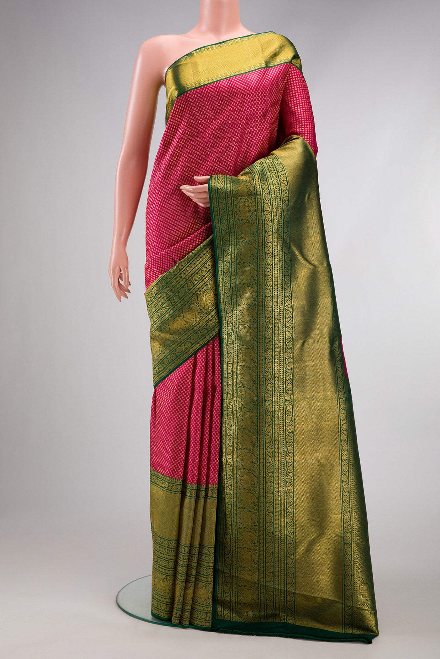 Pink Kanjivaram Silk Saree with Zari Brocade on the body and Zari Border.  displayed on a mannequin