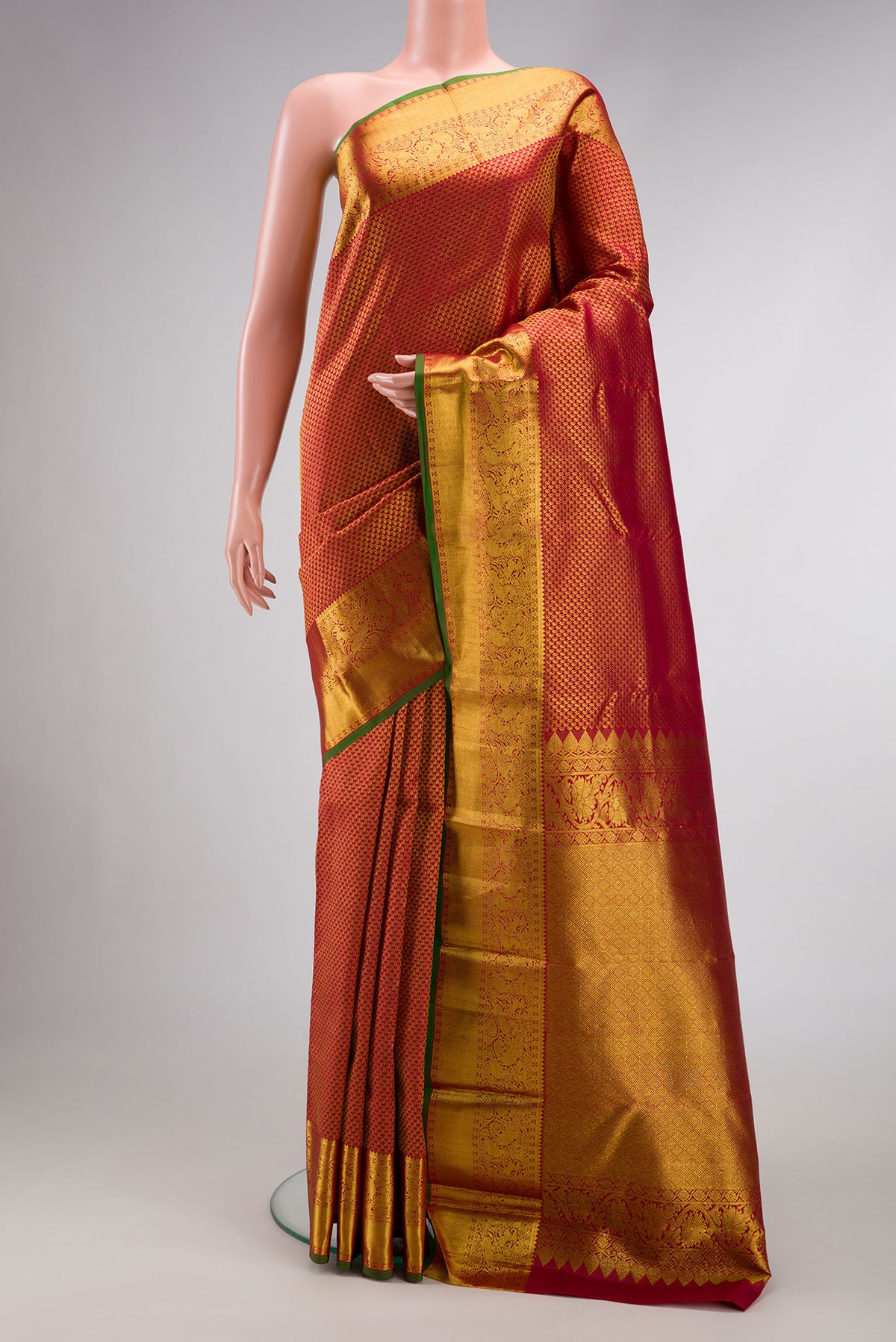Maroon Dual Tone Kanjivaram Silk Saree with Zari Brocade on the body and Zari Border.  displayed on a mannequin