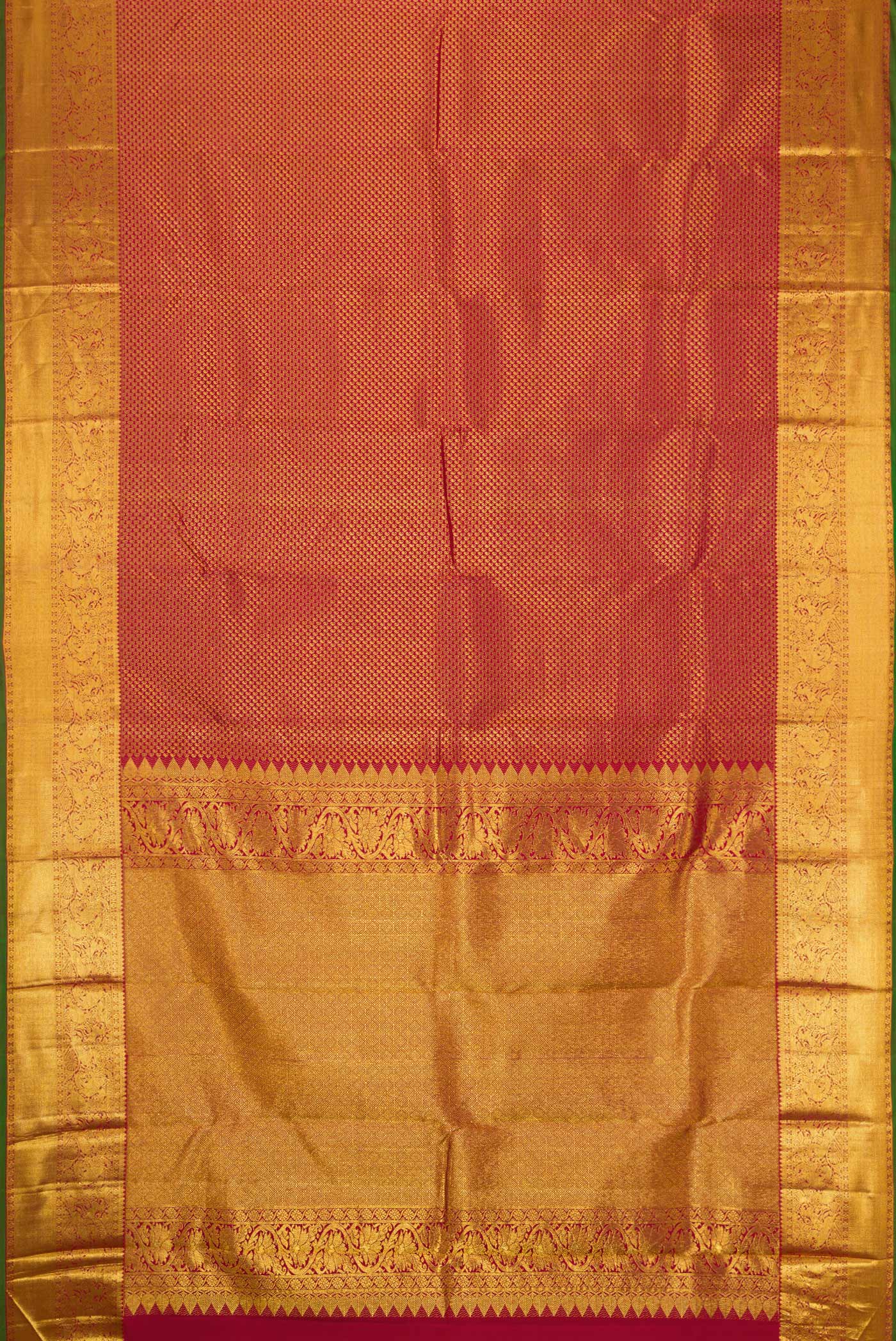 Flat view of Maroon Dual Tone Kanjivaram Silk Saree with Zari Brocade on the body and Zari Border. 