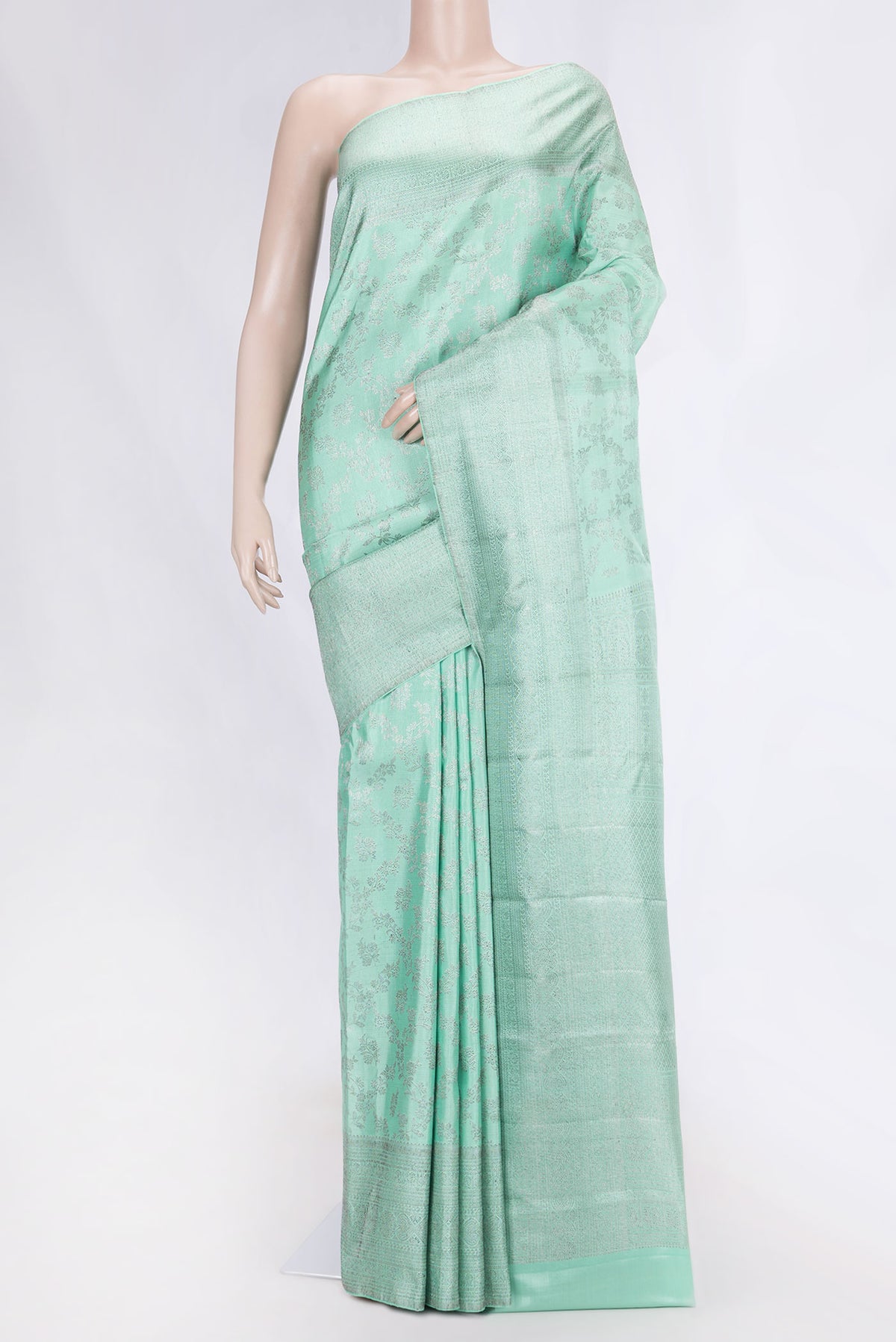 Sea Green Dual Tone Kanchipuram Silk Saree with Zari Brocade on the body and Zari Border displayed on a mannequin