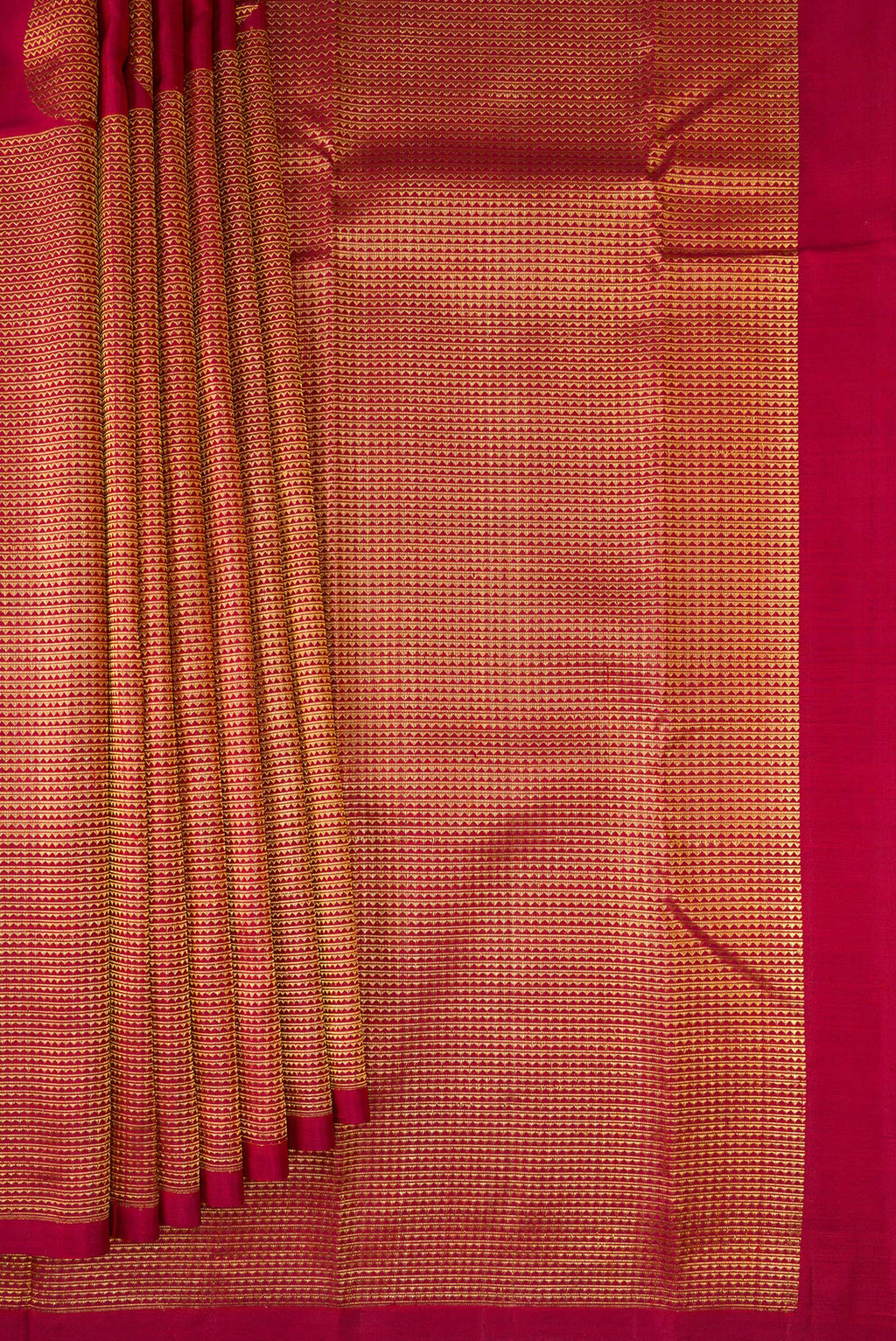 Pleats and pallu of Maroon Kanchipuram Silk Saree with Half And Half on the body and Without Border. 