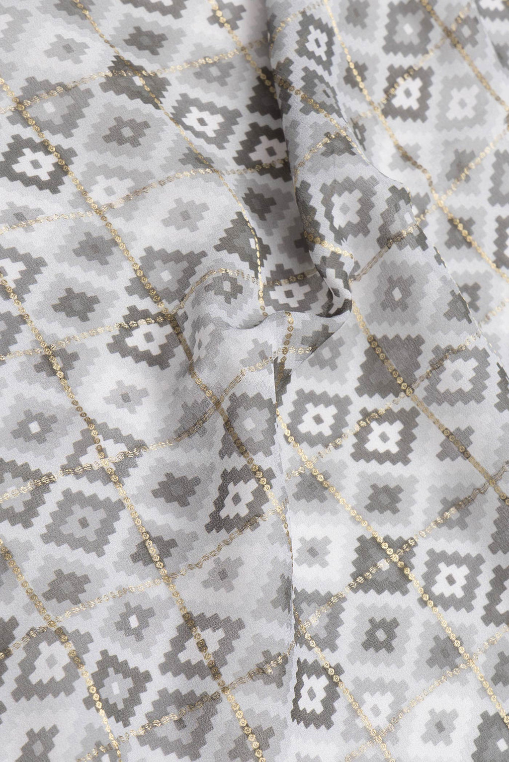 Close up of Grey Dual Tone Mysore Georgette Saree with Checked design on the body and Zari Border.  displaying folds