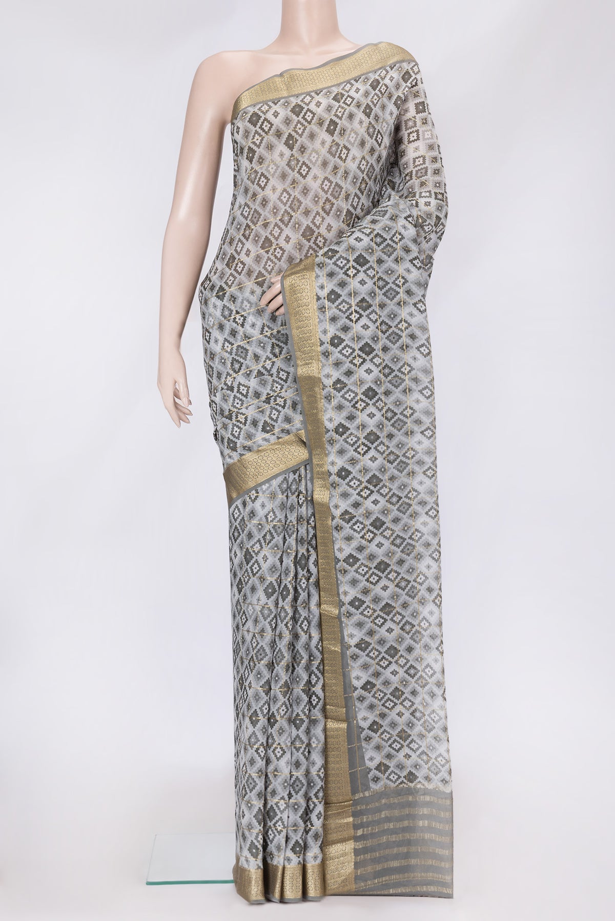 Grey Dual Tone Mysore Georgette Saree with Checked design on the body and Zari Border.  displayed on a mannequin