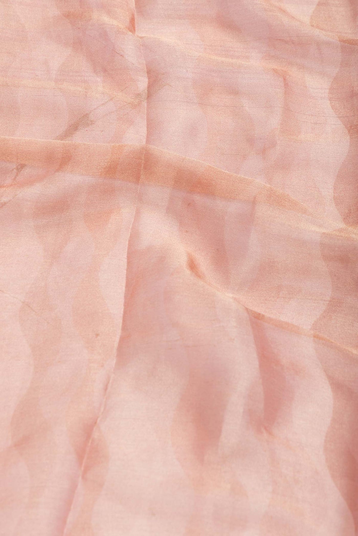 Close up of Peach Dual Tone Mysore Georgette Saree with Zari Brocade on the body and Zari Border displaying folds