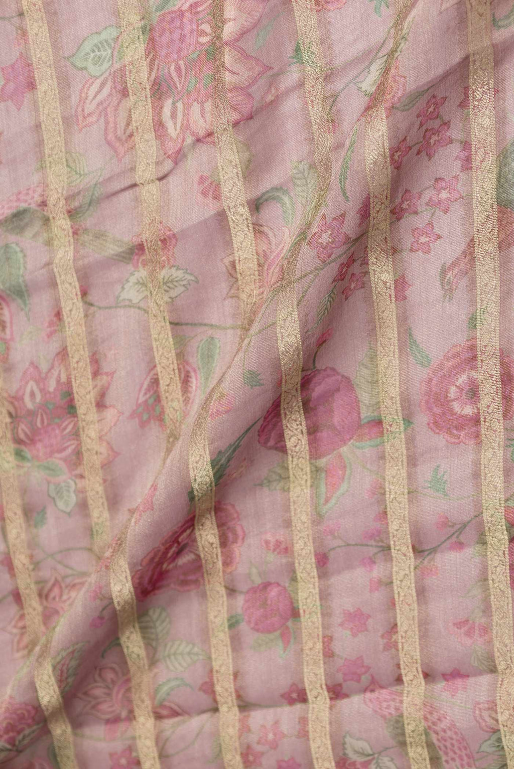 Close up of Dark Pink Mysore Georgette Saree with Printed design on the body and Zari Border displaying folds