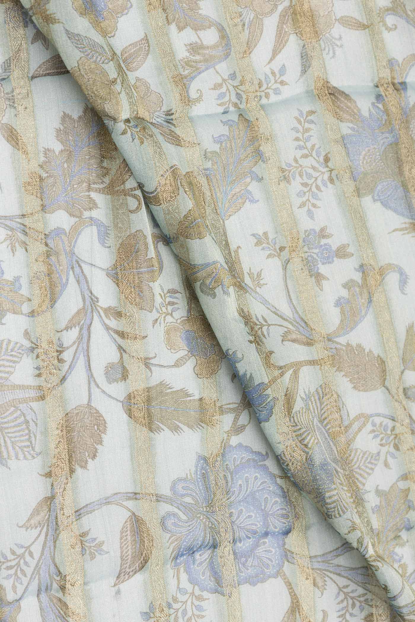 Close up of Light Blue Dual Tone Mysore Georgette Saree with Printed design on the body and Zari Border displaying folds